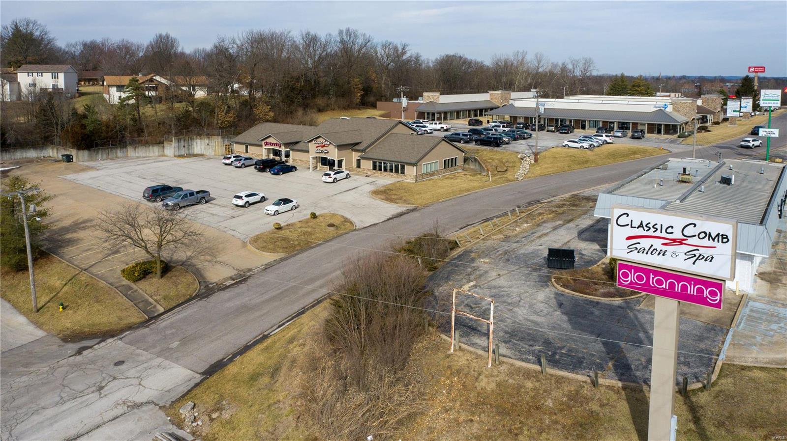Location and Exposure at its best!! On average over 20,000 vehicles a day travel by this location! This building was purchased in 2014 and has had a complete renovation completed during the year of 2015. Which includes new roof trusses, roof, windows, framing, electrical, plumbing, flooring, paint, HVAC, exterior, and so much more! The sellers also resurfaced the asphalt parking lot at that time. The west unit offers an amazing build-out with approx. 2150+ sq. ft. of multi-use space offering a small break area, office, and ADA restroom. The East side unit offers over 4600+ sq. ft with 2 full bathrooms, (1) of which is ADA compliant. This area offers an amazing entry foyer, sitting area, tons small breakroom area and access to the second level which offers an additional kitchen area, bathroom, and office, and the mechanical storage area. Security System. Central Vacuum System. Over 260 Can LED can lights have been added to the East Side Unit. Sign Easement is included along Hwy. 47. Location: High Traffic, Retail Center