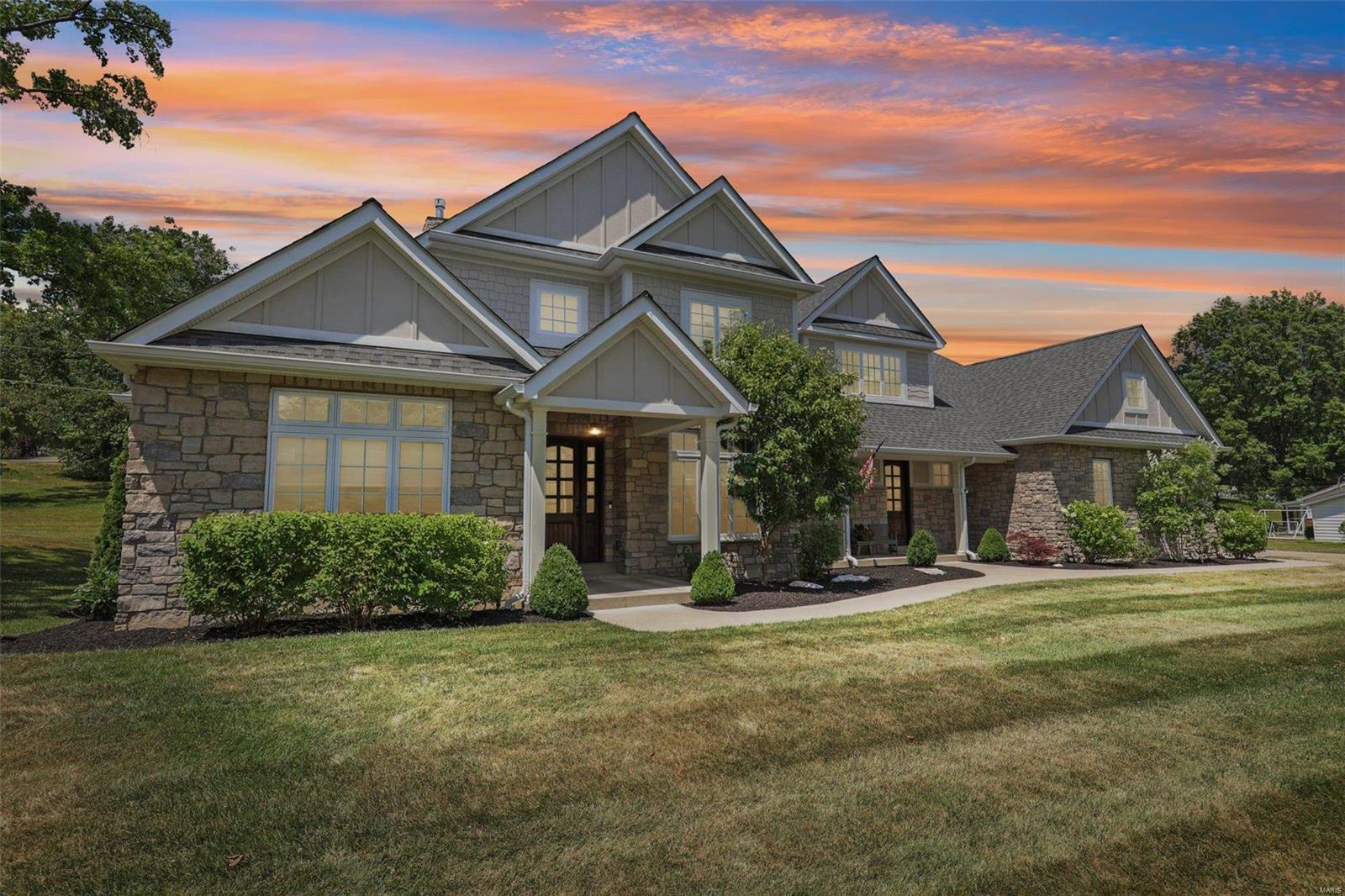 Step into luxury with this exquisite 6-bedroom, 5 ½ bathroom masterpiece nestled on a sprawling 1-acre lot. This 1.5-story home boasts soaring 10-foot ceilings, elegant 8-foot doors & stunning h/w floors throughout the main level. Entertain effortlessly in the spacious living room adorned w/ a cozy gas F/P, or unwind in the hearth room w/vaulted ceilings! The kitchen is a chef's dream, complete w/granite tops, a trayed ceiling, large island perfect for entertaining & a buffet area leading into the formal dining room. The main floor owner's suite is a sanctuary of luxury, offering trayed ceilings, his & hers closets w/custom built-ins & a primary bath retreat w/dbl adult-height vanities, granite tops, a water closet & sep tub/shower. Enjoy a 4-car garage with extra storage! The UL offers 2 large bedrooms & a versatile flex room! Descend to the fin LL where you'll discover 2 add'l bedrooms, a full bath & a spacious living room perfect for hosting guests or creating a private retreat.