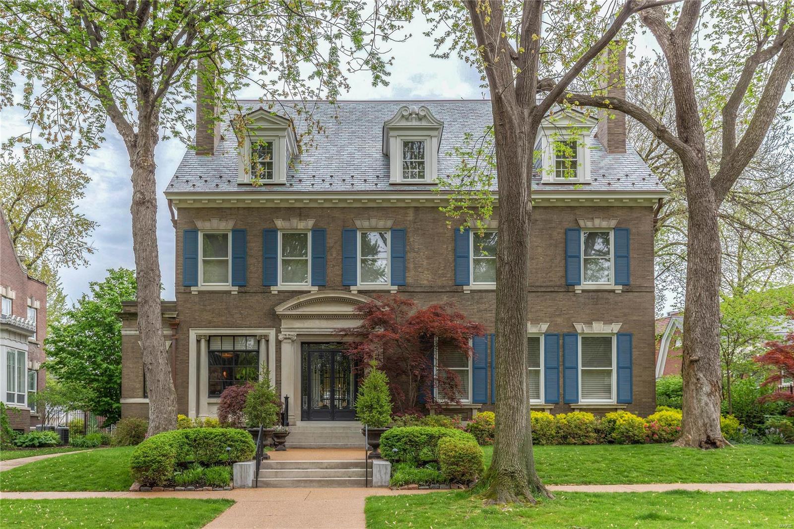 Georgian inspired historic and elegant home was designed by George Hellmuth and built for Joseph Stanley Walker who founded the Eli Walker Dry Goods Co. The gracious entry, flanked by an incredible original marble floored study opens to amazing living spaces-formal living & dining rooms and a warm family room. Renovations are extensive yet have maintained the integrity of the original home. It is a unique blend of charm and newer updates for today's lifestyle. The kitchen has been totally renovated w/heated limestone floors, new cabinetry, granite counters, and the finest appliances. The master bath & closet are amazing w/laundry adjacent. All bathrooms have been redone, 7 fireplaces, upstairs kitchen, huge media room, and newer slate roof are all part of the wonder of the home. The heated pool & studio attached to the garage is great for entertaining.

Tax records and MLS square footage do not match.  MLS square footage is correct at 7,608 base upon prior appraisal.