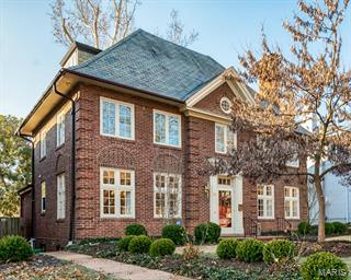 Built in 1916, this home has classic style and 2015 livability. Prepare to fall in love. Enter the foyer and see the winding stairway and the many, many architectural details. The formal living room with fireplace and built-ins adjoins the walnut paneled family room with French doors to a brick terrace and landscaped yard. A bank of windows let the sun shine in the updated kitchen that is a cook's dream with white custom cabinets, Thermadore gas cooktop, double ovens, an alcove for reading or a desk and a contemporary bath with double sinks and shower in marble. Two additional bedrooms and another newer bathroom are on the second floor. Follow the stately staircase up to the third floor and find two more bedrooms and a full bath. It is a perfect space for teens or guests. Walk to Forest Park, Washington university, schools, shops from your home in the wonderful Hillcrest neighborhood.