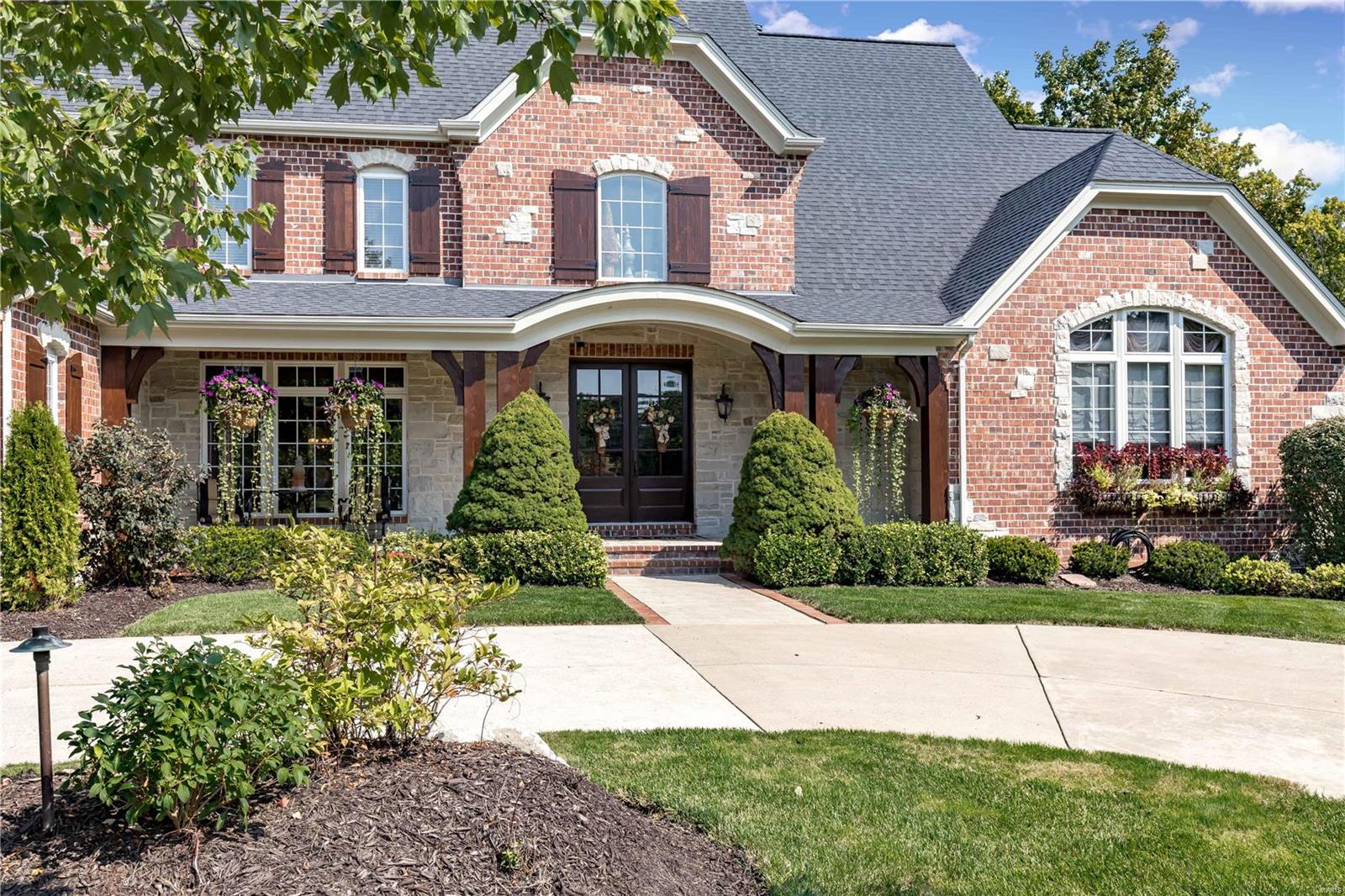 Welcome Home! Fisher & Fritchel custom built home situated on the premium lot in the Windgate Subdivision.  Very private luxury estate has award-winning finishes throughout to accent the numerous custom features.  Open floor plan & windows across the back of the house allow for lots of natural light & a very peaceful setting. 6 bdrms all with spacious walk-in closets & 7.5 baths. Main level walks out at 2 locations to a beautiful travertine patio & steps down to an inground pool with Sundek surround.  The pool also has side fountains for a relaxing atmosphere and a diving board.  The flat, fenced, secluded back yard is a rare find.  Lower level of the home walks out in 2 areas.  A double door in the media room leads into a large storage area.  2,000 sq. ft. of finished area in LL including a media room, wet bar, weight room, steam room and 2 bedrooms with Jack/Jill baths.  Oversized 3 car garage & 2 car garage/workshop.  Rockwood School District & only seconds from shopping & Highway.