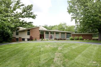 With the original home built in 1955, this 5 bd, 5 ½ bath mid-century modern home has been renovated and expanded for today’s lifestyle.  An open concept main level with Brazilian Cherry flooring, gorgeous custom kitchen with 2 lg islands, SubZero, Viking and Miele appliances, flows seamlessly into the open dining and living areas.  An office, half bath, and mudrm complete the first lev.  Up the stairs, find 2 lg bedms with high ceilings and Jack & Jill bath with 11 ft double vanity, and heated slate floor.  The master suite offers sweeping views of the 1.78 private acres.  A custom 15x16 closet with laundry, spa bath with heated floor, sep custom vanities, & lg air jet tub comprise this private retreat.  Stepping down to the next level, find a lg family rm with walk out to the heated salt water pool, private pool bath and 2 lg bedrm suites with lg windows on 2 sides.  A rec rm in the low lev.  Dual pane solar reflective windows, multi speed programmable thermostats, and much more