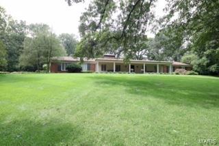 Incredible opportunity to live in one of Ladue's finest areas.  Beautiful, treed 3.1 acres with large ranch home with inground pool ready for your improvements or build your new luxury home on this level and gently sloping lot.  Neighborhood owners have gated access to Hwy 40/64.  Exceptional opportunity to live near Ladue's horse trails surrounded by wildlife, while convenient to schools, shopping and private clubs. Property sold in "AS IS" condition. Additional Rooms: Mud Room
