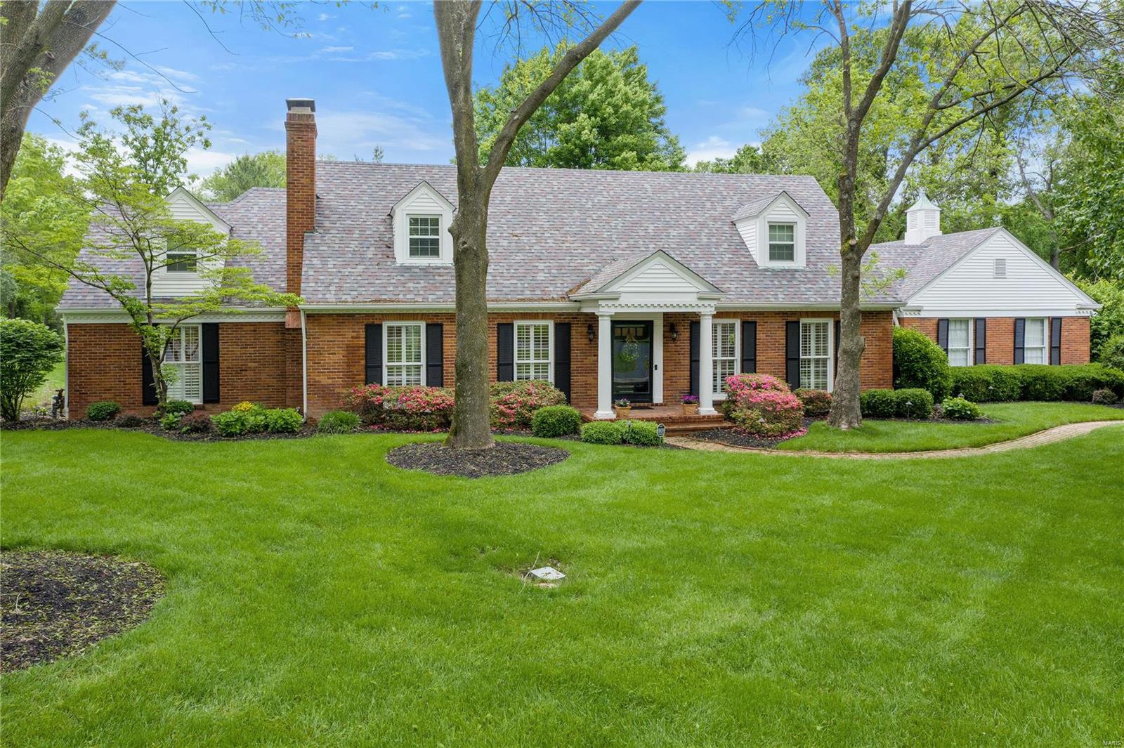This quintessential story-and-a-half home is tucked away in a tree-lined Ladue neighborhood on a professionally landscaped acre+ with pool, five bedrooms, five full baths and two half baths.  The residence has been meticulously updated to compliment today’s busy lifestyle.  Improvements begin with an updated main floor master suite with spa bath and massive walk in dressing room/closet.   The sunny kitchen features stainless appliances, updated custom cabinetry, beautiful granite counters and opens to the family room with custom bar and to the breakfast room.  A formal living room and spacious dining room complete the first floor.  The second floor has four large bedrooms, loft area and two baths.  The finished lower level is finished with a recreation room, sixth bedroom and full bath.  A tiered deck with pergola and newly added pool bath overlooks the pool.  The home and its amenities offer luxury living at its finest in the Ladue School district/Conway grade school! Additional Rooms: Mud Room
