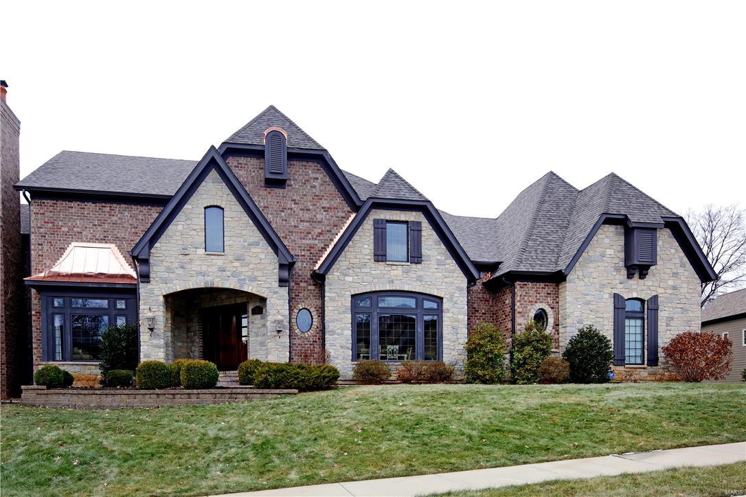 Balancing traditional and modern with richly layered interiors, this all brick and stone home adapts to almost any lifestyle.  With over 4200 sq. ft. of beautiful spaces and incredible levels of finishes, the spiral staircase serves all 3 levels and opens to the formal DR and handsome paneled study with floor to ceiling bookcases.  A stunning top of the line kitchen adjoins the hearth room with bar, wall of palladium windows and breakfast room with bay that walk out to private patio.  Main floor master suite demands his/her exceptional closets and luxury bath with walk in shower and soaking tub. Upstairs are two lovely bedroom suites. The W/O lower level has been framed out with drawings available to finish to the buyers specifications.  3 car oversized garage, 2 powder rooms, 1st floor laundry with sink and storage, new roof and gutters in 1/17 with numerous upgrades throughout.

The brick wall connecting 11 and 15 Ladue Court is FACADE ONLY.  They DO NOT share a common wall.