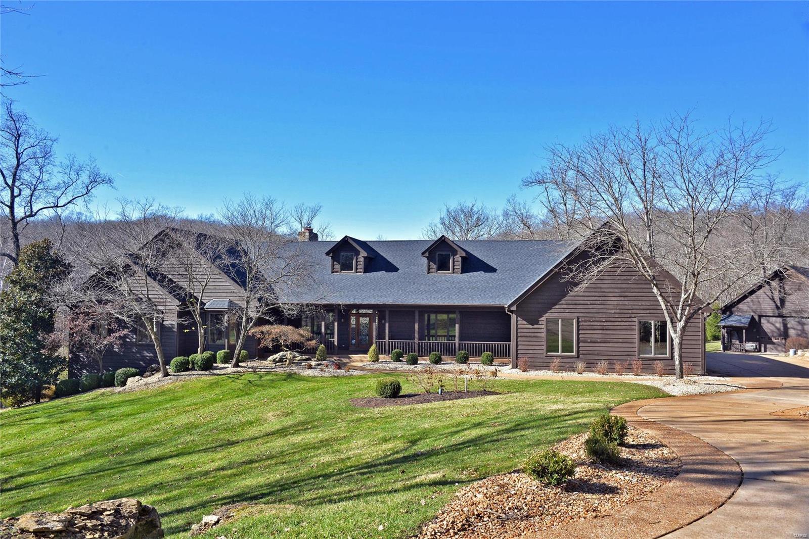 Hardwood flrs have been refinished.WOW!New painting thruout! You must come see!Picturesque setting pond & backdrop of tall trees is home to this striking Wildwood atrium ranch. New roof March 2020. Home features 5 bedrooms & 4 1/2 baths & approx 7,500 sqft of well appointed living space.Special amenities include open floor plan, vaulted & gazebo style ceilings. Hardwood & tile floors.Magnificent remodeled kitchen & baths. Radiant floor heating through home & attached 4 car garage. 2 masonry fpls, 2 wet bars.Custom curved staircase to the lower level family rm,5th BR/workout rm & pool table area.2” wood blinds & closets by St Louis Closets.Spectacular outdoor living space is set on private & beautifully landscaped 5 ace lot.2 waterfalls 1/3 acre pond, deck & fenced area with Gunite in-ground heated salt water pool.Stamped concrete patio & outdoor kitchen. Detached heated & cooled garage 76x38.LL Fam rm w/ pool table area,Travertine floors & dry stacked stone columns. Additional Rooms: Sun Room