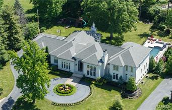 Off Clayton Road in Frontenac. Modern Custom w/ "Smart" electronics. 8200SF total living. Resort lifestyle. 5BR/6BA, New pebble tec pool, stamped concrete patios, waterfalls, fountains & slide. Refined sophistication w/highest level finishes. Two-story entry opens to a bank of French doors leading to 1000SF covered patio & terrace, formal gardens & grounds. Kitchen features 2 islands, Viking, SubZero, Fischer Paykel, Hearth Room, brkfst room & walls of windows cascading natural light. Main level Master w/luxe bath & room-sized closet. Flooring of exotic woods & stone. Made-to-order lighting. Designer paint, millwork, & faux finishes. Sweeping 15' & 17' ceilings. 2nd level: 3 en-suite BRs & play area. Lower Level: professional Exercise, Media, & Billiard Rooms, full spa bath w/steam shower & rm for future Wine cellar. Main level laundry & planning rm. Expanisve grounds, w level flat yard. Minutes  to sophisticated shopping & dining at Plaza Frontenac, steps to Highway 40. Additional Rooms: Mud Room, Sun Room