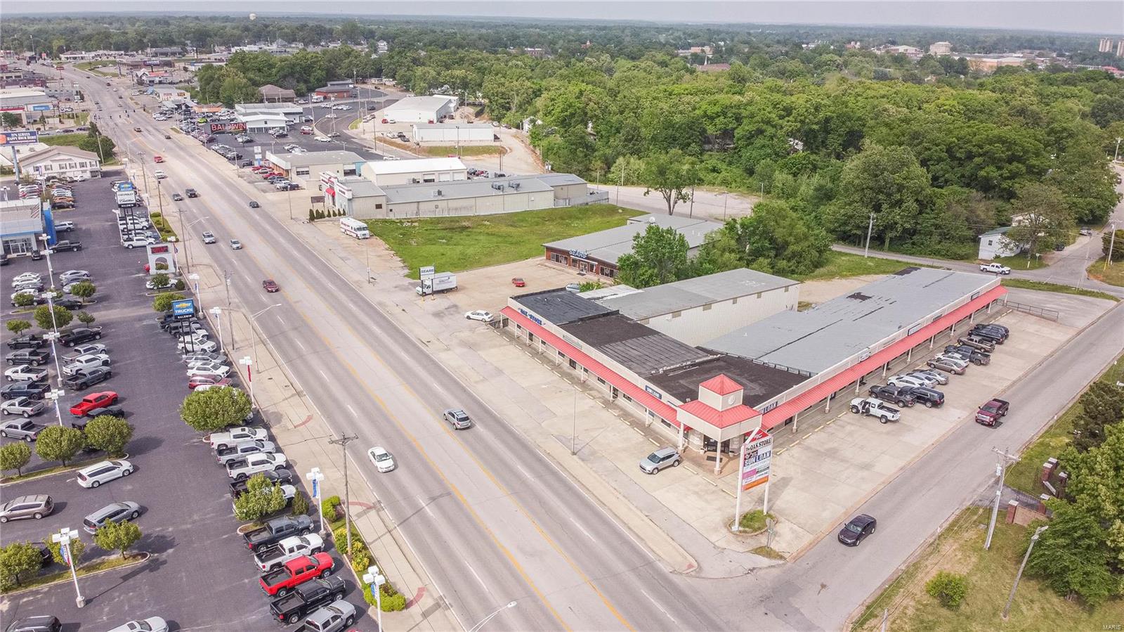 $1,750,000. 740 S. Westwood Blvd. PB. 1.65 acre m/l with 14,800 sq. ft. strip plaza "L shaped" commercial building sitting in prime high traffic area in town! This property incudes 12 suites, each having their own restroom and heating & cooling units. Several units have basement storage with overhead doors. Location: City, High Traffic