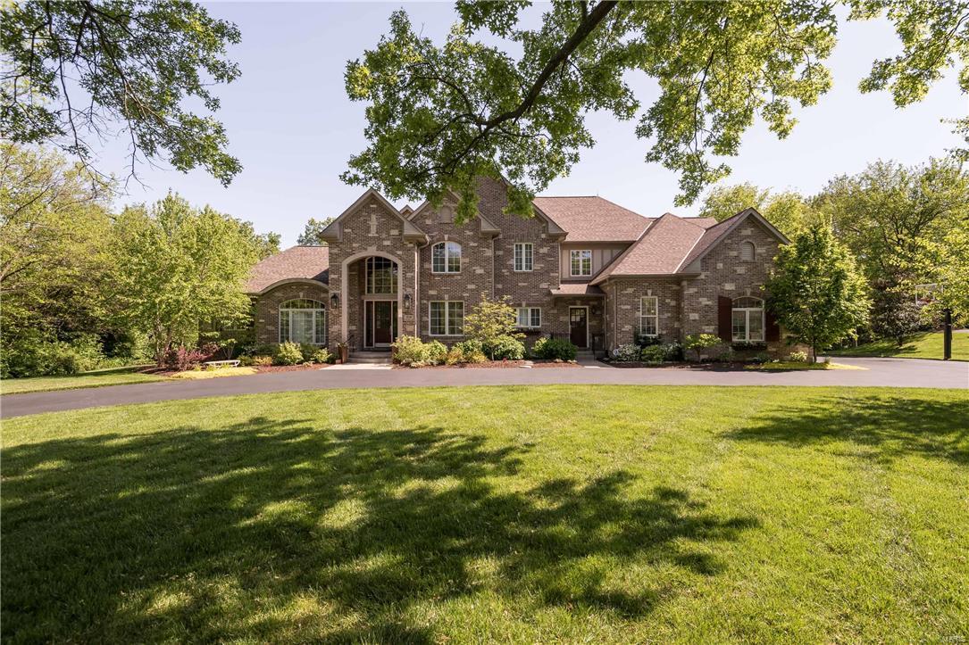 Beautiful 1.5 story home situated on a gorgeous 1+acre lot in Frontenac. This pristine home has a stunning interior with marble entry foyer, wood floors and wonderful architectural details. Approx. 6,000 sq. ft. on main & upper levels plus approx. 3,289 sq ft. in the finished walk out lower level. Luxury main floor master suite with deluxe bath. Second floor features a loft and 4 additional bedrooms each with private bath. Gourmet kitchen has custom cabinetry, granite counters, breakfast bar, center island with prep sink, 6 burner Viking range, Sub-Zero refrigerator and walk in pantry. The walk out lower level has spacious rec room, media room, sleeping area, full bath, second laundry room and French doors leading to the pool area. Enjoy entertaining in the park like back yard featuring the 8 yr. old Pooltron saltwater pool, and patio area with wood burning fireplace. Additional features: Inground sprinkler system, 4 car garage, 2 laundry areas, alarm system and central location. Additional Rooms: Mud Room