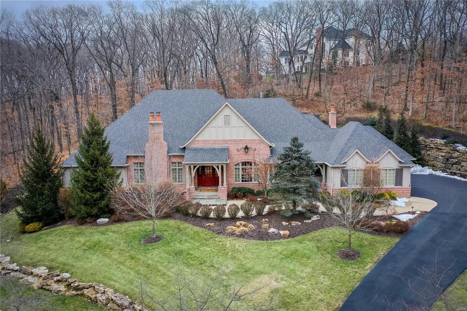 Pristine Deshetler Home! Meticulously maintained and move-in ready. Situated on a private 3+ acre lot, you'll be quite impressed as you make your way up the driveway passing over the brick bridge and creek. Enter the home into a beautiful travertine foyer and be surrounded by the stunning detail throughout. Nearly 5,000 SF, this home features arched entries, tray ceilings, built-in illuminated bookcases, multi-piece moldings, wainscoting, "Savant Smart Home System" w/ surround sound inside and out, wet bar, marvelous chef's kitchen, 4 bedroom suites, 4 fireplaces, salt-water pool, stunning waterfall, exquisite sun porch w/ fireplace, BBQ patio with bar & gas grill, irrigation system, professional landscaping & lighting and much more. Located in the Gold Star and Blue Ribbon Rockwood School District, it's just a 5 minute drive from Chesterfield Valley where you can find everything you need -  premium outlet malls, Top Golf, numerous restaurants, and shops.  Prepare to be wowed!