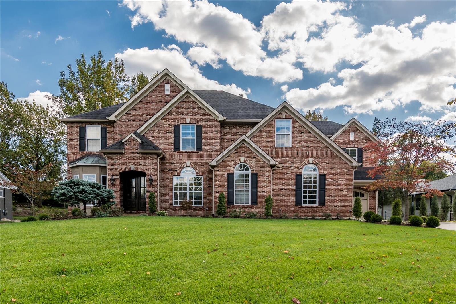 Discover timeless luxury in this custom home, blending classic style with modern comfort. Enjoy an open floor plan that effortlessly connects all living spaces. The gourmet kitchen is a chef's dream and is perfect for gatherings w/ loved ones. A formal living room with floor to ceiling windows and a cozy breakfast room w/ a gas fireplace complement the kitchen. Near the back of the home, the family rm opens to a beautifully landscaped yard perfect for outdoor living and entertaining. A guest suite w/ a private entrance is also on the main level. Upstairs, find the primary bedroom suite w/ 2 walk-in closets, laundry rm, 3 additional bedrooms, 2 full baths, and a spacious bonus rm. The partially finished lower level offers a bar, recreation area, fitness rm, an extra bedroom, a full bath, and ample storage. A 3-car garage w/ mud rm and a lg .68-acre lot add to the impressive list of features. Located in the renowned Ladue school district, this home defines refined living at its best. Additional Rooms: Mud Room
