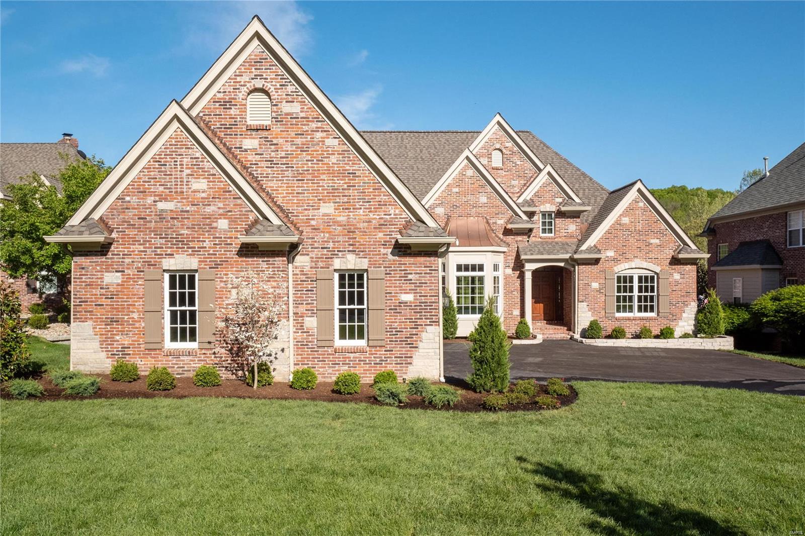 This BRAND NEW designed and built St Albans Construction home backs to the golf course and is the perfect size. Everyone is looking for that new open floor plan that is not overly large, is built with great quality and has all new everything that has been upgraded inside and out. Well, here it is! This home is nearly 100% masonry which means low maintenance. The covered Lanai with masonry fireplace (and another fireplace below on the patio) is off the great room and provides one of the best golf course views in St. Albans. You can enjoy the course view, but the golfers are off in the distance. This three bedroom ranch has 3 ensuite bathrooms and there is room to expand if you need more bedrooms, or an exercise room or a theater room. A cook's kitchen with all new stainless appliances, large island with storage and counter seating and beverage bar are all part of this wonderful and thoughtfully designed new home in St. Albans. This is your Missouri home that you will keep forever. COOL: 14 SEER+