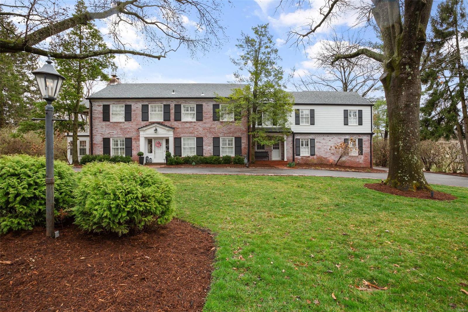This stately colonial situated in Ladue's Briarcliff neighborhood is what dreams are made of. Surrounded by mature trees and a circle drive, this 4 bed/6 bath exudes grandeur and class. Thoughtfully updated w family in mind, from the open kitchen/hearth room & multiple main floor living spaces, to a finished LL & laundry on each flr. Main level includes Formal LR, sunroom, Dining Room, study, powder room, Kitchen, hearth room, mudroom, screened in porch & 2+ car garage. 2nd floor includes 4 generous bedrooms & laundry closet. Oversized primary suite includes sitting area w/ gas fireplace, marble tiled bathroom & 2 large WICs. The guest suite features a spa-like bathroom, 2 closets & access to sleeping porch (could be converted to a 5th bed). Find 2 add'l bedrooms (1 large enough to divide or share) and hall bath. Finished LL includes several open rec spaces, wet bar, and 1.5 baths. Heated, saltwater pool features pebble-tec finish w/deck jets. Additional Rooms: Mud Room