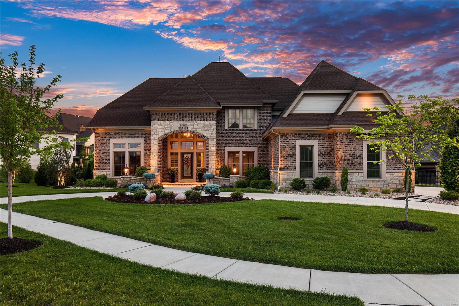 Owning this home is your chance of a lifetime to own a personal oasis. Owner filled home w/interior & exterior amenities beyond the imagination including HD Golf Simulator/Theater Room, numerous outdoor spaces w/remote controlled screens, Crestron Media system controls music, lighting, heater for saltwater pool w/integrated spa, fire bowls, water features, & custom lighting. LED Landscape lights. Outdoor kitchen w/beverage center, grill, Green Egg, granite counters, screened-in porch w/vaulted wood accented ceiling & stone frpl. Anderson windows, Open kit/hrth rm w/12' long kitchen island/bkfst bar. Sculpted ceilings, wainscot, shutters, finished closets & custom paint colors. Box beams, Beverage center & 100+ bottle wine cellar. LL bar w/Kegerator, dishwasher, custom cabinets. LL includes exercise/or bedroom as you desire, gaming area w/built in seating, full bath conveniently located to walkout w/changing area for use w/pool area. All bedrooms are ensuite. You won't want to leave!