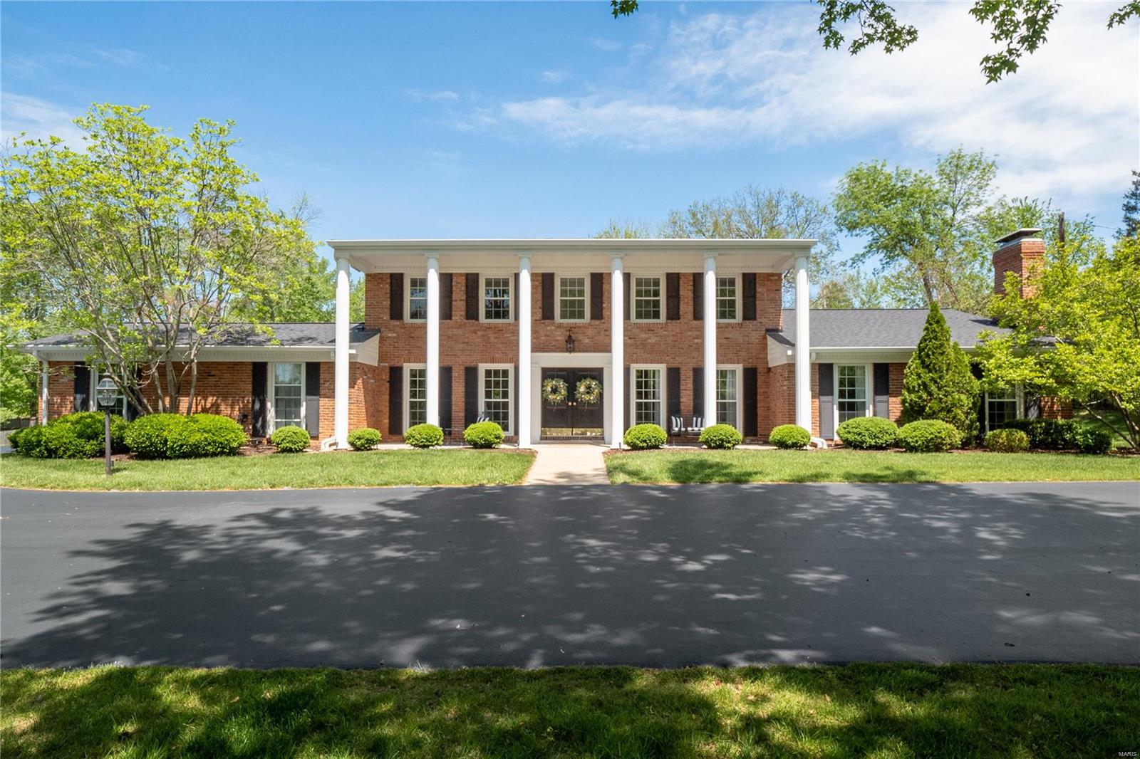2 Stoney Brook Lane is a classic 2-story brick home, which sits back on a gracious 0.87 acre lot, tucked on a private lane in Ladue.  The wide circle drive, stately covered porch & double front door entry offer a very warm welcome.  The center foyer is flanked by the traditional dining room & sunken living room, both with windows facing the front of the home. The kitchen, breakfast room with fireplace, window-lined family room & two 1/2 baths are recently updated with modern, custom finishes.  The main floor master suite is generous in size & private with access to back patio.  The expansive patio is fitting for outdoor entertaining & a perfect set-up for adding a pool.  Main floor laundry/ mud room & 2-car attached garage.  Four additional large bedrooms, one is an en-suite, plus another full bath complete the second level.  The finished basement adds more living space & storage.  Award-winning Ladue School District. Conveniently located near interstates, Ladue shops and restaurants. Additional Rooms: Mud Room