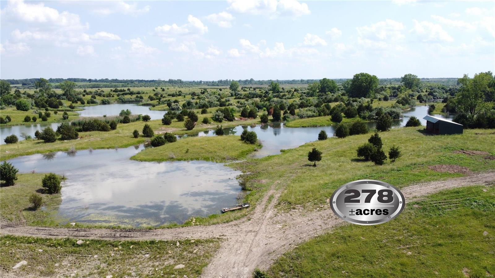 278 acres of prime recreational ground in St Clair County, IL. This was one of Peabody Coal Co executive places to fish & hunt.  There are approximately 40 acres total of water, which includes a 25 acre lake 35’ deep that has been stocked with bass, crappie, and walleye. Waterfowl hunting of ducks and geese is available with the land lying in the Baldwin Power Plant fly zone. The property is currently being used for pasture. This tract of land is surrounded by larger tracts holding the pressure on the game down. If you are looking for a getaway not that far away check out this piece of land that is outside city limits. Only 45 miles from St. Louis and 29 miles from Scott Air Force Base.
