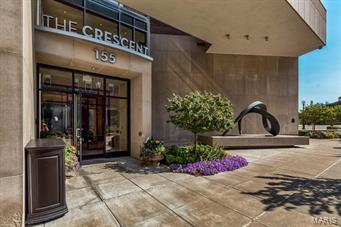 You have wanted to live in luxury and now you can in Downtown Clayton!  The amenities of The Crescent will set a new standard for your expectation in service.  Elegant, upper floor unit with large terrace overlooking the Garden will offer a sanctuary for your family and friends.  With over 2,900 sq ft of living space the floor plan offers both open and private retreat spaces.  Formal LVNG and DNG RMS include built-in shelving, gas FRPLC & bar area.  Substantial kitchen w/ Wolf & Subzero appliances, breakfast bar & stone counters.  Separate family RM.  Master bedroom offers a built-in office space, two separate walk-in closets, a luxurious master bath with double vanity, soaking tub and large shower.  The 2nd en-suite bedroom is ideal.  Full size utility room.  Unit offers great opportunity for storage and closet space.  24-hour door man, valet service, fitness center, ½ acre garden with dog park & fitness center.  Two garage parking spaces and additional storage is included. Location: City, Downtown, Upper Level