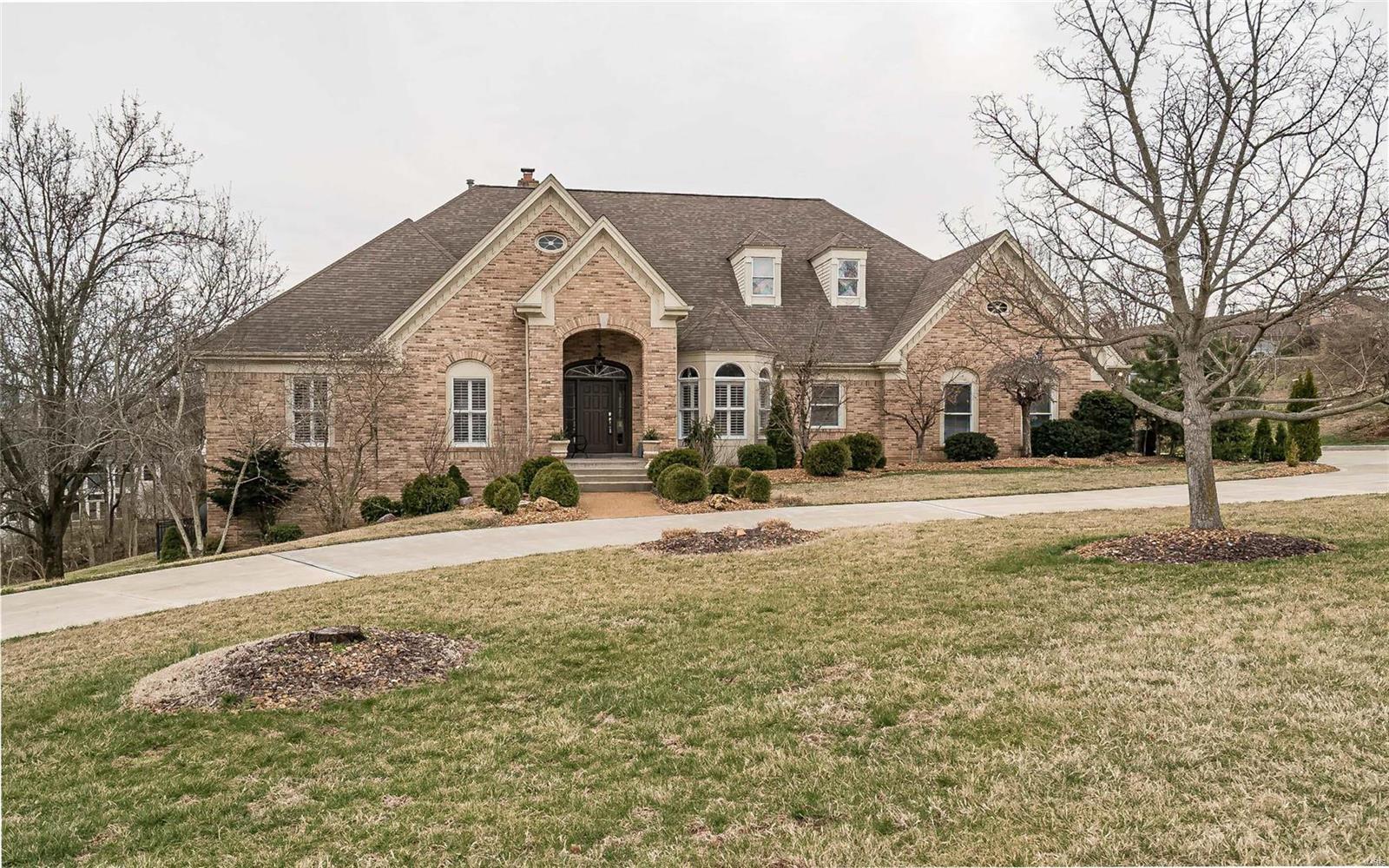 Stunning Higginbotham-built atrium ranch in premier Town & Country location! Open floor plan features soaring ceilings, curved walls, plantation shutters & maple hardwoods. Dramatic coffered foyer highlighted by architectural columns leads to private study, sophisticated dining room & spectacular great room with floor-to-ceiling marble fireplace, skylight & expansive wall of windows. Designer kitchen with maple cabinetry, granite countertops, commercial grade appliances, planning center & butler’s pantry adjoins octagonal breakfast room & vaulted gathering room. Sumptuous master bedroom suite with barrel-vaulted ceiling, architectural columns & luxury bath with jetted tub plus 2 additional ensuite bedrooms complete the main floor living quarters. Lower Level includes recreation room with fireplace & wet bar, game room, flex/playroom, office, workout room, 4th bedroom suite & ½ bath. Situated on a 1-acre lot with deck with pergola, patio, firepit & pool surrounded by landscaped gardens.
