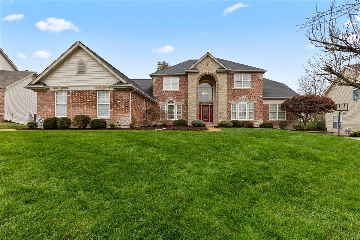 This 1.5 story Tapawingo Golf Club brick home exudes elegance w/ a rich beautiful red brick complemented by large windows and a covered front porch. The entryway leads into an open living area with high ceilings and large windows which flood the space with natural light. This kitchen is a dream with granite counters custom cabinetry and beautiful appliances. A family room off the kitchen provides additional family space or seating. 1st floor; a luxurious primary suite with its own living room to relax alone, or cuddle up and watch a movie. The primary bath is complete with 2 walk-in closets, double vanities and an extravagant stone shower. 2nd; youll find 3 generously sized bedrooms with their own private bathrooms making this home ideal for family living. An open loft perfect for a library or home office. Outside is a patio and large stone fire pit perfect for entertaining. The lower level includes another bedroom bathroom, kitchen, wine cellar, rec room, theatre. In Lindbergh Schools Additional Rooms: Wine Cellar