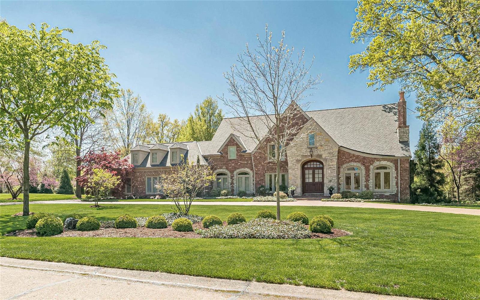 This Johnson built 4 bedroom, 4.5 bath home offers beautiful spaces and incredible levels of finishes.  Elegant yet comfortable, this stunning home is ideal for entertaining inside and out. The 2 story entry leads to the wood paneled study with FP, great room with soaring wall of windows, wet bar and FP flanked by bookcases and chic dining room with butlers pantry. Fabulous kitchen  flows openly to the breakfast and hearth room with vaulted ceiling and floor to ceiling stone fireplace that walks out to awesome screen porch and pool area. The main floor master wing demands access from the study, includes luxury bath with his/her vanities, walk in shower,  Jacuzzi and his/her closets.  Upstairs are 3 bedroom suites with custom walk in closets.  Terrific main floor laundry with "her" built in desk and mudroom off the oversized 3 car garage. Walk out lower level is a blank canvas ready for your personal design. Gunite heated pool , hardwood floors, back/front staircase and one owner home Additional Rooms: Mud Room