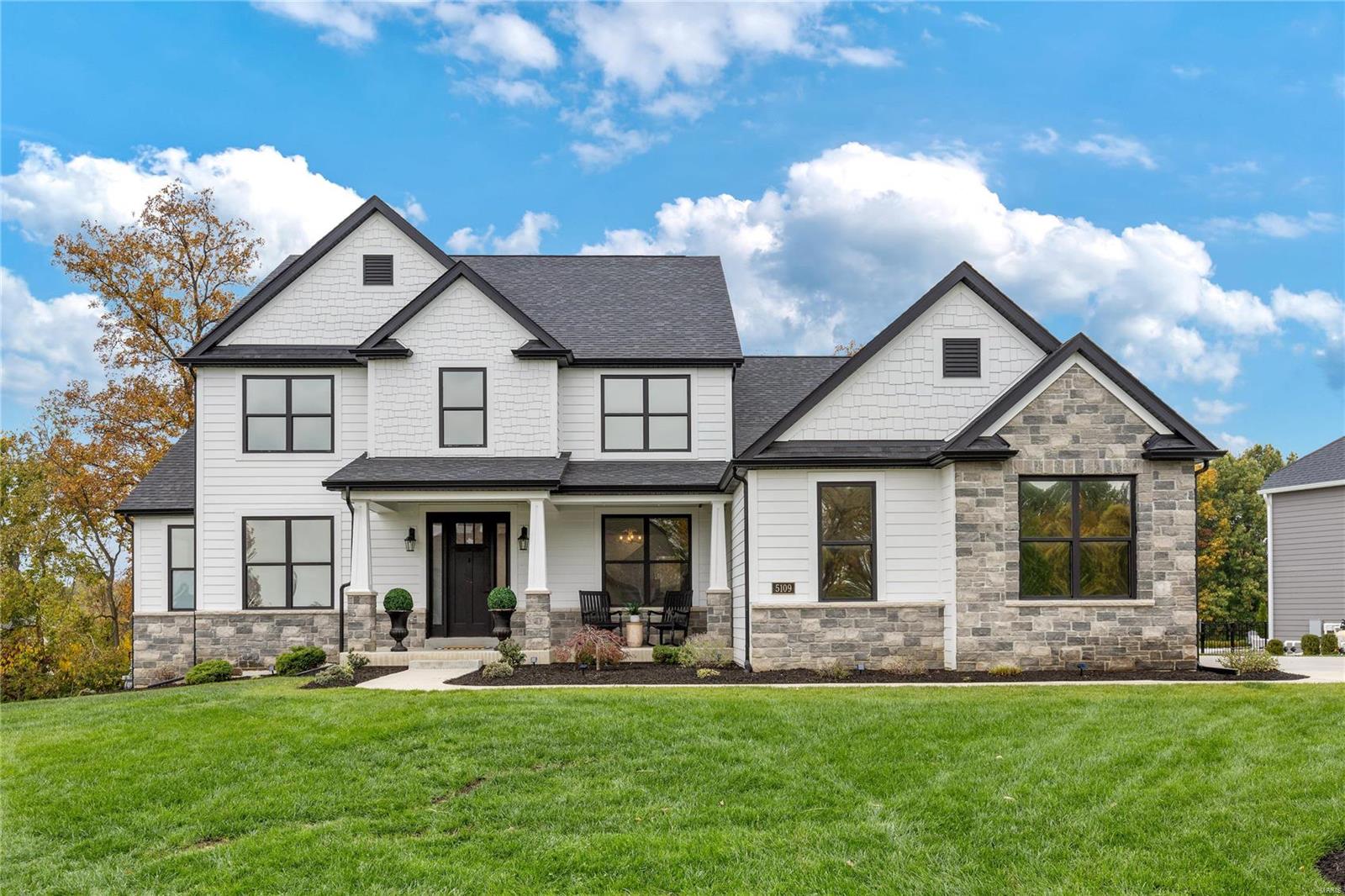 Just completed in 2021, this sophisticated 1.5 Sty features soaring ceilings, extensive trim work & wide plank oak flooring that extends throughout the main floor living area. Impressive entry foyer leads to dining room with box beam ceiling and stunning great room with floor-to-ceiling fireplace & dramatic wall of windows. Designer kitchen with 42” white Shaker cabinetry, quartz countertops, professional appliances & 7’ center island adjoins light-filled breakfast room that opens to deck. Coffered primary bedroom suite with luxury bath offers an appealing retreat. The 2nd floor extends the living quarters with 3 additional bedrooms, 1 with ensuite bath & 2 with Jack n’ Jill bath, & bonus room. Walk-out Lower Level includes recreation room with entertainment center, linear fireplace & 8’ quartz bar plus office, workout room, flex room & full bath. Sliding glass doors open to outdoor living area with deck with grilling station, lower level deck with firepit, covered patio & sport court. Additional Rooms: Mud Room