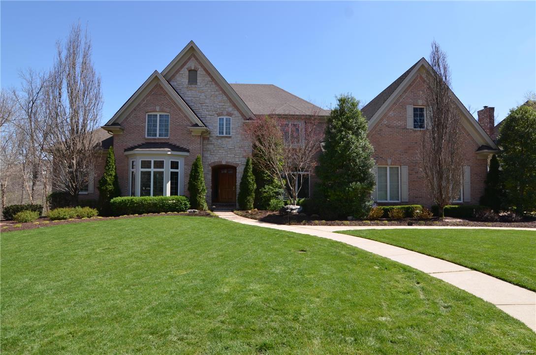Stunning 1.5 story, oversized 3 car garage. Kitchen with solid surface counters, oversized center island, high-end stainless steel appliances & gas range. Breakfast room, cozy Hearth room and private Screened Porch. Beautifully decorated Dining room and Office. Bright living room with beautiful views. Large master suite with fabulous Master bath featuring upgraded adult height cabinetry, counters, flooring, fixtures and 2 walk-in closets equipped with St. Louis Closet Company built-ins. Large 1st floor laundry, Hardwood flooring, some plantation shutters and custom crown molding and 3 fireplaces. Impressive open staircases lead you upstairs or down to the lower level. 2nd floor offers 3 bedrooms a Private suite, 2 bedrooms with Jack & Jill bathroom plus Bonus room. Lower level has a 5th bedroom, full bath, Gym, Entertainment area, Family room with see-thru fireplace, Wet bar with full size fridge and microwave. Gorgeous inground Baker Pool, Hot Springs Spa and view of the Lake! Additional Rooms: Sun Room