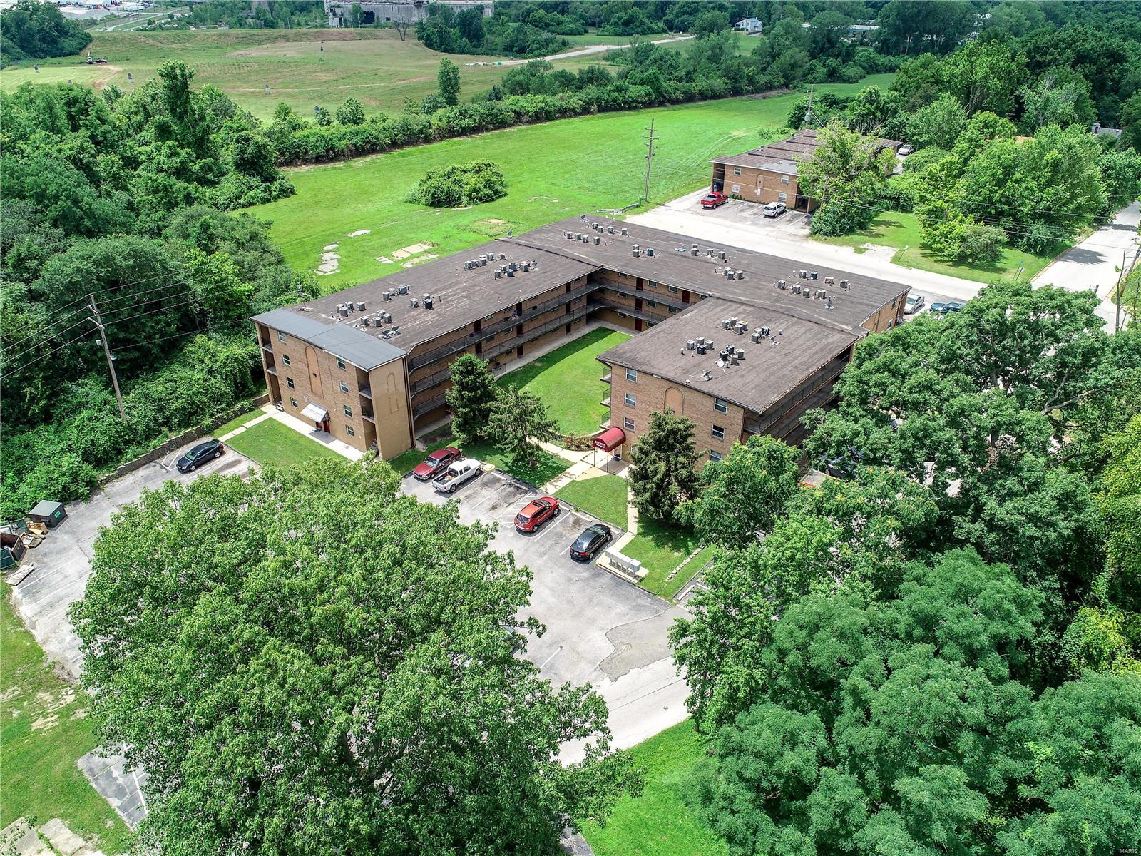 Opportunity to purchase a large well maintained 86 unit apt complex located on secluded 1.5-acre lot overlooking the Mississippi River. This 46,442 sq ft complex is comprised of 68 one-bed units, 17 two-bed units & one efficiency unit. The total gross inc for 2019 was $393,524 with net operating inc of $198,398 which is a 8.8% cap rate with the ability to raise rents and add value. 29 units were recently renovated in 2020 and there have been significant recent capital improvements totaling $318k over the last few years including new HVAC, appliances, a new roof on the 20 unit building, porches, etc. On-site management office, on-site laundry with new cashless washer/dryers installed, large maintenance storage space, camera monitoring system. All-electric complex. Building is currently 85% occupied and rising, historical occupancy above 90%.