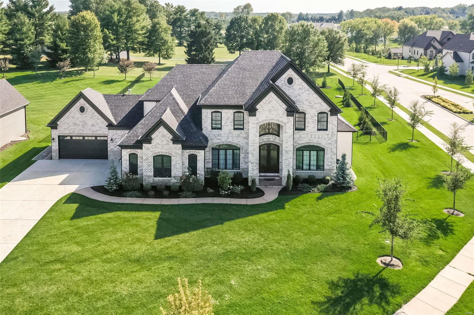 Located in prestigious Fienup Farms, this impressive 1.5 story leaves nothing to be desired! Breathtaking curb appeal, 5 beds, 4.5 baths, 6500 finished square feet, and the exquisite outdoor pool and spa, add a heightened element of opulence! 2-story foyer is the grand entrance to a luxurious, sun-kissed open floor plan! The kitchen, adorned with quartz counters, Jenn Air appliances, and a walk-in pantry, exudes modern elegance and functionality. The breakfast room flawlessly transitions into a vaulted sunroom bathed in natural light. Great room is worthy of its name with soaring ceiling, f/p framed by built-in bookshelves, and enchanting pool views! Main floor master suite is fit for royalty with 2 WICs and an enormous bathroom! Beautifully finished basement includes rec room with wet bar, 5th bedrm, and full bath. Zoned HVAC, sprinkler & security systems, whole house speakers, Nest thermostats, the list goes on! Residents enjoy walking trails, tennis & inspiring lake views!