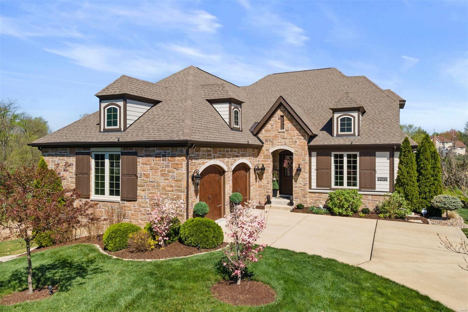 Stunning 1.5 story custom home built by Pulte in 2016, situated on a private cul-de-sac in Creekside at Mason. Large gourmet kitchen opens to a gorgeous hearth room with 11' coffered ceiling and gas fireplace. The kitchen features a butler's pantry, bar, granite counters, 5 burner gas cooktop, stainless steel appliances, and a walk-in pantry. Designer kitchen provides outdoor access to large composite deck for grilling and entertaining. Two master suites on main plus a bright spacious office, dining room, mudroom & laundry room. Large family room and 3rd bedroom suite on upper. Multiple outdoor living areas - composite deck, covered stone patio, fire-pit gathering circle for chilly evenings and a private fenced in yard for children or pet enthusiasts. Loads of storage in the walk-out lower level, an oversized 2 car garage, and new high end lighting throughout. Meticulously maintained and exquisitely appointed. Additional Rooms: Mud Room