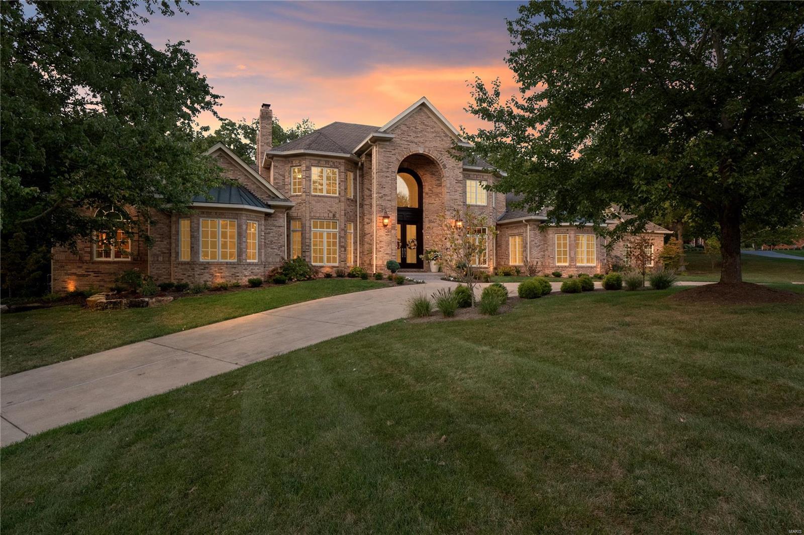 From the moment you are arrive you can't help but notice the exceptional blend of classic details, chic finishes, and an incredibly functional and liveable floorplan on 1 private wooded acre with more than 7500 finished sq ft. No detail has been overlooked in this stunning move in ready home. This level of craftsmanship is rarely seen and you will fall in love with the exquisite woodwork and multiple stunning Schonbek crystal chandeliers. The home boasts an amazing 2 story foyer along with a 2 story den, a master oasis complete with a designer closet, private custom home office, stone fireplace and sitting area. The second floor has 3 bedrooms all with their own large bathrooms. Some of the many updates include; the sleek custom kitchen, relaxing backyard retreat and high end lighting and sound technology throughout. As if that's not enough, the lower level contains a bar that you want to pull up a seat and relax, large wine closet, home gym, steam room, game room and a theatre. Additional Rooms: Sun Room, Wine Cellar