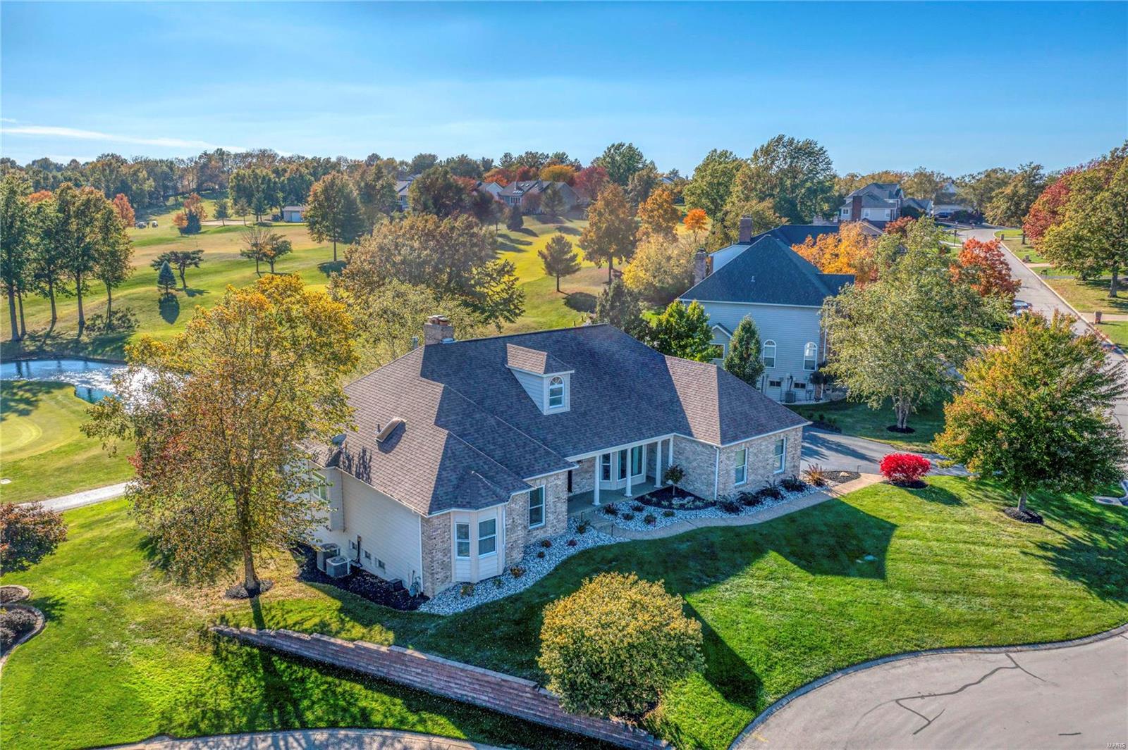 This sophisticated brick atrium ranch features an open floor plan with soaring ceilings, bamboo flooring & expansive windows that offer unsurpassed golf course views.  Vaulted foyer leads to study with built-in bookcases & French doors, formal dining room & stunning great room with beamed cathedral ceiling & floor-to-ceiling brick fireplace. Designer kitchen featuring white cabinetry, quartz countertops, premium stainless steel appliances & 8’ center island adjoins breakfast room with wide bay window & light-filled sunroom with quartzite bar & atrium door that opens to screened porch. Primary bedroom suite with luxury bath with shower spa & private deck plus an additional ensuite bedroom complete the main floor living quarters. Broad atrium staircase accesses Lower Level entertainment space with recreation room with brick fireplace, game room with wet bar, spa room with sauna, 2 additional bedrooms & 2 full baths. Situated on a premium cul-de-sac lot with 2 decks, patio & 3-car garage. Additional Rooms: Sun Room