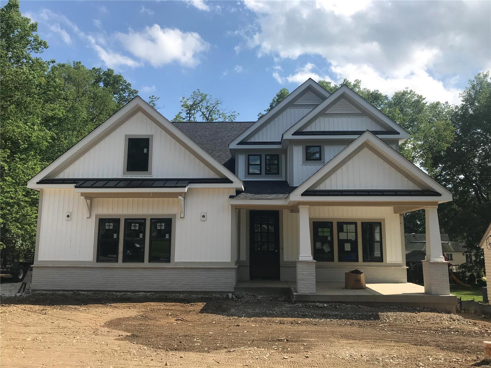 Spectacular new 1.5 story on large lot under construction by Boulevard Custom Homes.  This 5 bedroom, 4.5 bath, home features astounding finishes which include a side entry garage,  hardwood flooring 1st floor and 2nd floor hall, gourmet kitchen with true custom cabinetry, large island and peninsula counter, crown molding, soft close drawers, 3 lazy susan's, pull-out spice rack, trash pullout, Quartz countertops, stainless steel appliances, under cabinet lighting, large walk-in pantry, built-in lockers, and impressive screened in rear porch.  12' high beamed ceiling in great room offers a fireplace, wine bar with wine cooler,  den/study with beautiful wainscot. Elegant master bedroom suite boasts coffer ceiling, walk-in closet, adult height vanities, stand alone tub in master bath. Mahogany wood front door, wood treads on stairs, a expansive 2nd floor bonus room, 2 full baths on 2nd floor, large bedrooms with walk-in closets.  Finished lower level with rec room, full bath, and bedroom