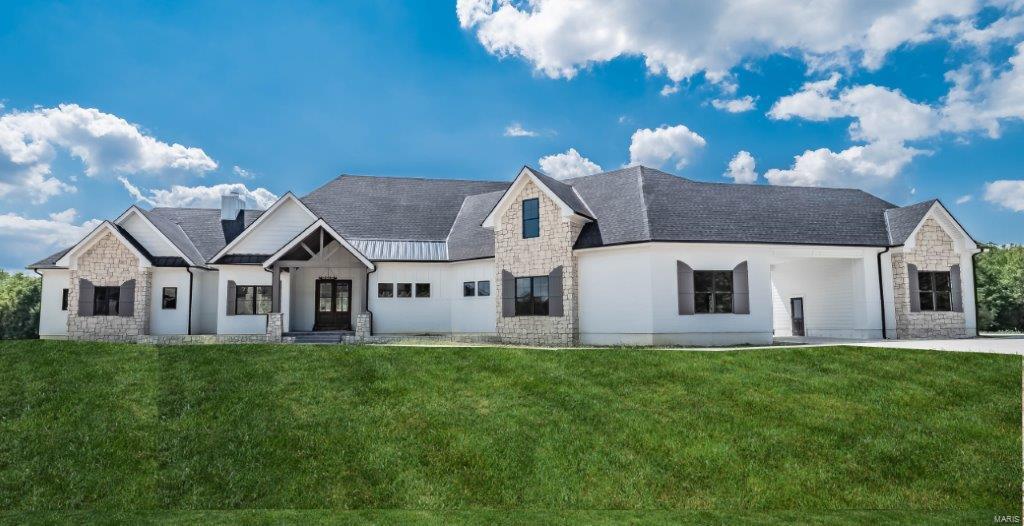 Extraordinary Presence! 4.2 Acres-Tree Lined Lake lot* Gated Development* Exquisite & Light Filled Great Room showcasing 15' Intricate Custom Designed Ceilings, Floor to Ceil Stone Wdbrn FP, nearly 12' Hearth* 7" Oiled white Oak Floors* Gourmet Kit, Furniture Grade Custom Cabinetry, 10' Solid Surf Island, 48" Viking range + Butlers pantry-Wet bar* Dual Dshwshrs* Grand Owners Suite, Brick Accent Wall* Sleek 20x12 Luxury Ba* Bonus area or Din Rm* Upper Loft* Secondary Bdrms are En-suite* Lwr Lvl Fam/Rec,Bdrm-Myriad of possibilities* Dual wlk-out to spacious patio. Entertainers Oasis! Massive Composite deck, 1/3 screened, w/open area to enjoy Sunset Views* Car Enthusiast? 3 Car Garage, 2 Car Detached, w/Lwr Lvl garage access to hold possibly 4 addtl cars or utilize as a Theatre Rm* 10' Foundation Ht* Advanced HVAC systems (7 total zones incl heat/cool garages) * 1st Class Insulation System-Healthy, Comfortable/Economical* Whole house Sec, AV System* J. Hardie Siding. Brick/Stone/Cedar Additional Rooms: Mud Room