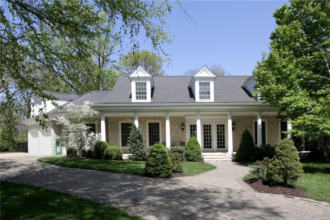 Built by Jim Minton and just 12 years new, the inviting front porch will draw you in to this outstanding 2-story custom home with incredible details. Offering an entertainer's paradise at its best, this 4+ bedroom, 4.5 bath home is sophisticated yet comfortable balancing soaring 10' ceiling and beautiful open spaces. The slate entry allows front to back views that open to dining room and cozy paneled library with fireplace, sunny great room with fireplace, wet bar and French doors to new patio with gas grill and outdoor fireplace. Fabulous kitchen with breakfast bar adjoins the hearth room with box beamed ceiling and breakfast room with patio access. The spacious 1st floor master suite has luxury bath and large custom closet. Upstairs are 3 gracious bedrooms with walk-in closets and generous office/playroom. Lower level has new wine cellar, family area, full bath w/ steam, exercise room and tons of storage. Perfect Executive home with over 5000 sq. ft. and 1400 finished in lower level.
