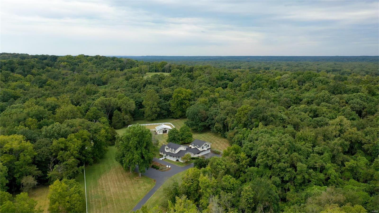 Welcome to an exquisite 3.3 equestrian estate gracefully cradled in the picturesque embrace of Wild Horse Creek Valley,renowned as the Gold Coast of Wildwood.This remarkable property boasts a sprawling 5+bdrm residence,Fin LL,creating an abundance of living space that graciously accommodates both family& guests.Nestled conveniently close to the vibrant Chesterfield Valley,this estate provides effortless access to a plethora of amenities,ranging from shopping & fine dining to a diverse world of entertainment options.For those w/deep appreciation for nature & the outdoors,this estate is a gateway to the expansive beauty of Babler State Park.Over2,400 acres of breathtaking natural landscapes and 6miles of dedicated equestrian trails await,providing an idyllic retreat for horse enthusiasts&nature lovers alike.Easy access to Spirit of STL airport.Discover the epitome of opulence &serenity as you immerse yourself in the exceptional ambiance of this equestrian estate.6.383 LOT SOLD SEPARATELY Additional Rooms: Mud Room