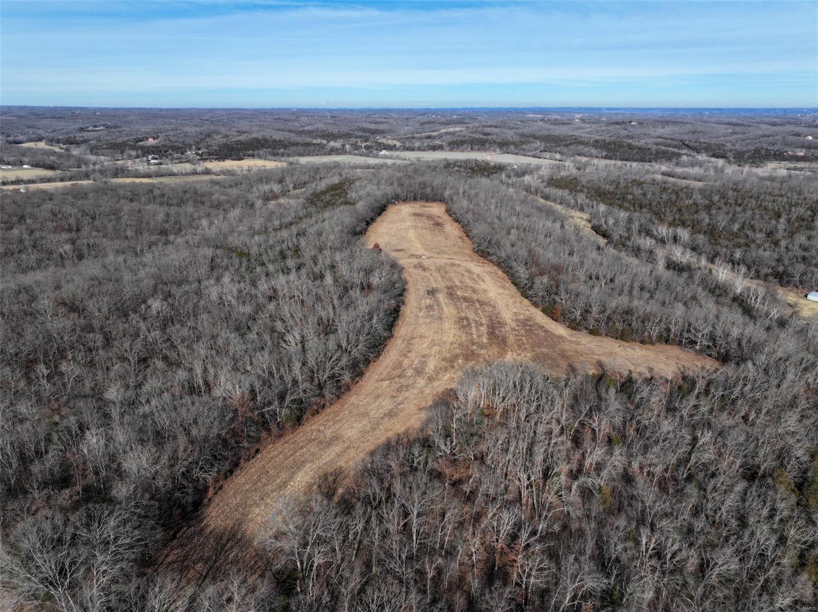 Beautiful property with a big ridge running north to south for the entire length of the property. Beautiful open pasture ground making a great location to build. The Joachim Creek flows along the Northern border allowing for plenty of fun in the creek. The combination of timber and open ground make this property a great home for wildlife like deer and turkeys.