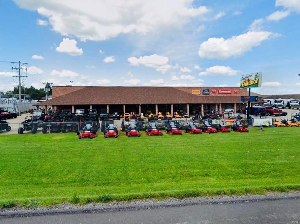 Located in a high traffic and visibility area just a minute off I-55 in Jackson is this 21,500 SF brick and block building with showroom, shop/warehouse, and office space all under one roof.  The ground floor is 16,500 SF, consisting of approximately 10,000 SF showroom, 4,500 SF warehouse, and 2,000 office and common areas.  The upper level consists of approximately 5000 SF of loft storage/utility space with two staircases and an upper overhead door for forklift deliveries.  Five overhead doors offer multiple heights ranging from 8 to 14 feet high.  The warehouse has 20 foot ceilings, floor drains, wash bay and 3-phase electric.  With two paved fenced areas and 20+ parking spaces, this property is suitable for a variety of uses. Location: City, Corner Location, High Traffic