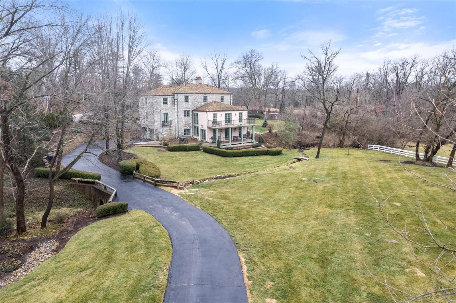 Discover the charm of 3 Countryside Lane in Frontenac, Missouri. This architectural gem is a 4,000 sq ft stone residence on a sprawling 1.15-acre lot. The property is adorned with mature trees that lend a timeless charm to the surroundings. The landscape offers a sense of tranquility and privacy, providing a serene backdrop for both indoor and outdoor living. The expansive views from the property showcase the beauty of Countryside Lane creating a sense of escape while still being conveniently located in Frontenac. The current owner's list of improvements is extensive: New Marvin windows/doors, 2 new decks in 2020, and a new stone driveway in 2021, to name just a few. Three fireplaces add warmth to the spacious interiors filled with abundant natural light. The thoughtfully designed layout seamlessly blends comfort and style, creating an inviting atmosphere for both relaxation and entertainment. Don't miss your chance to get into one of St. Louis's most coveted neighborhoods.