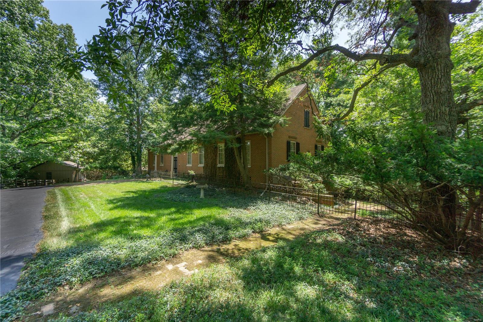 RETURN TO AN ERA OF GRACIOUS LIVING IN THIS FULL BRICK, COLONIAL-WILLIAMSBURG 2-STORY on 7.3 AC Designed by Arthur Johnson in 1955 on the original Kehr family farmstead. The Main Home, Guest House & Pool are surrounded with century old, forged iron fencing, brick walkways & patios. This lovely estate is in the Heart of Chesterfield, yet lives like a private nature reserve. 11 Room, 4Br/3.5Ba has wide plank, red oak flooring, 2 fireplaces, historic, locally resourced barn beams, brick flooring in breakfast room & butterie (pantry), plus a sunroom with tiles from Sicily. Spacious 2 room/1 bath guest house with garage & basement serves as changing quarters for pool & provides main floor space for office or hobbies. Suitable for horses, 3 acres with Kennelwood underground fencing is in place for pets. No subdivision indentures. BACKS TO "COUNTRY PLACE". LIST OF MANY OTHER SPECIAL FEATURES IS AVAILABLE ON A SEPARATE DOCUMENT. Adjoining 3 acre lot is for sale, listed at $399,000. Additional Rooms: Sun Room