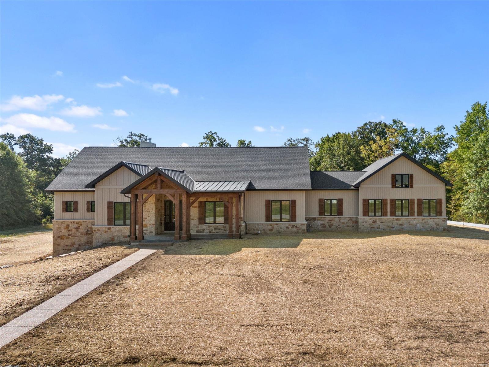 Incredible custom home from Work Horse Construction, situated on a 3.6+/- lot. Beautiful front elevation, rear entry oversized garage, timber frame covered back porch and the perfect floor plan.  The super functional layout features a huge open kitchen/great room area with vaulted ceilings and exposed beams.  The main floor private master is tucked away from the other bedrooms and features great space, a fantastic master bathroom and a massive closet. Also on the main level are two large secondary bedrooms, full bathroom, a study/office, mudroom from the garage and a separate laundry room.  Downstairs you'll find another large bedroom, full bathroom and a giant flex space with great natural light from the oversized sliding doors that walk out onto the lower level patio.  The remainder of the basement provides tons of room for storage, a workshop or additional space to expand. The design and finishes must be seen to be fully appreciated. Schedule your private tour today!