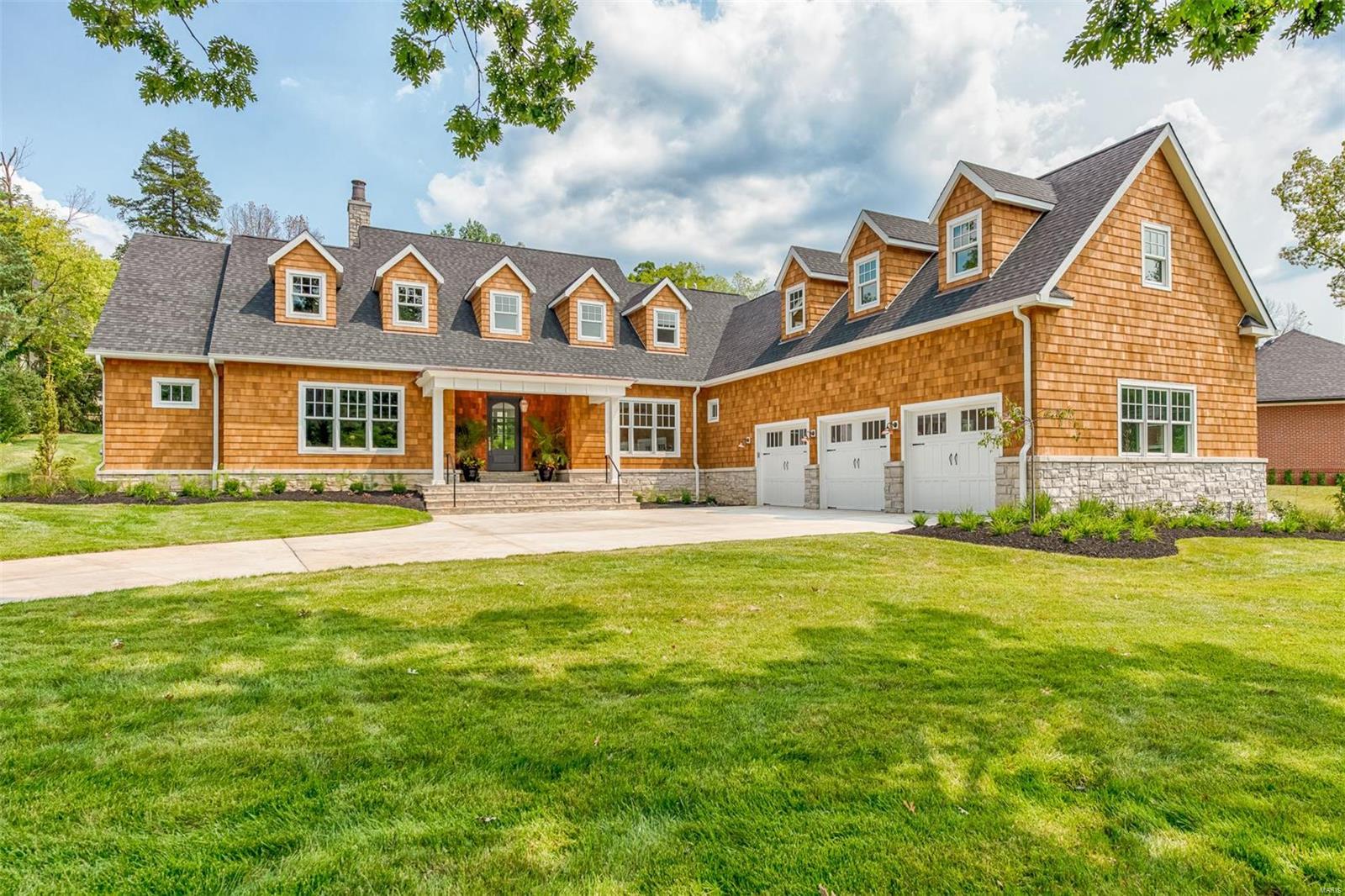 New, custom one and a half story Cape Cod by Kennerly Custom Homes is now complete! Upon entering this fantastic open floor-plan, you will love the high end custom finishes. There are beautiful hardwoods and crown and casement moldings throughout. This home is light filled and bright with beautiful open kitchen flowing into large Great Room with box beam ceiling overlooking lovely patio and yard.  Aspire to be a chef with the commercial grade appliances, expansive marble island and impressive white cabinetry. 
First floor Master Suite with state of the art luxury bath is impressive and beautiful. Main floor laundry room and mud-room with cubbies are an added bonus! Upstairs there are three wonderful bedroom suites with private baths and walk-in closets. Zoned HVAC, Surround Sound and alarm included. Lush landscaping with irrigation system. Great location near Tillis Park and Old Warson Country Club. Fantastic Ladue neighborhood. Additional Rooms: Mud Room