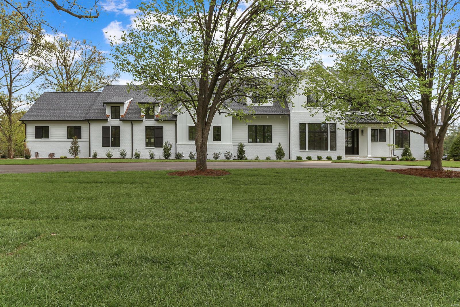 BRAND NEW CONSTRUCTION JUST FINISHED! This modern farmhouse is truly one of a kind- impressive millwork, built-in's, oak beams, designer lighting and hardwood floors throughout.  10' ceilings on the 1st floor and an abundance of light create a warm environment.  1st floor master suite features oversized custom closets, grand master bath, shiplap paneling, heated Carrara marble floors and free standing tub.  The gourmet kitchen hosts custom cabinetry,  Thermador appliances and Carrara marble counters - open to the breakfast room, walk-up bar and Hearth room with 14' vaulted ceilings.  A study, large living rm, mud/laundry area with multiple closets and 1/2 bath finish off this great 1st floor.  The 2nd floor with 9' ceilings hosts 3 bdrms all en-suite and a 2nd laundry room.  Other highlights include the oversized 4 car garage that must be seen, covered front and rear porches, and large private backyard. Additional Rooms: Mud Room
