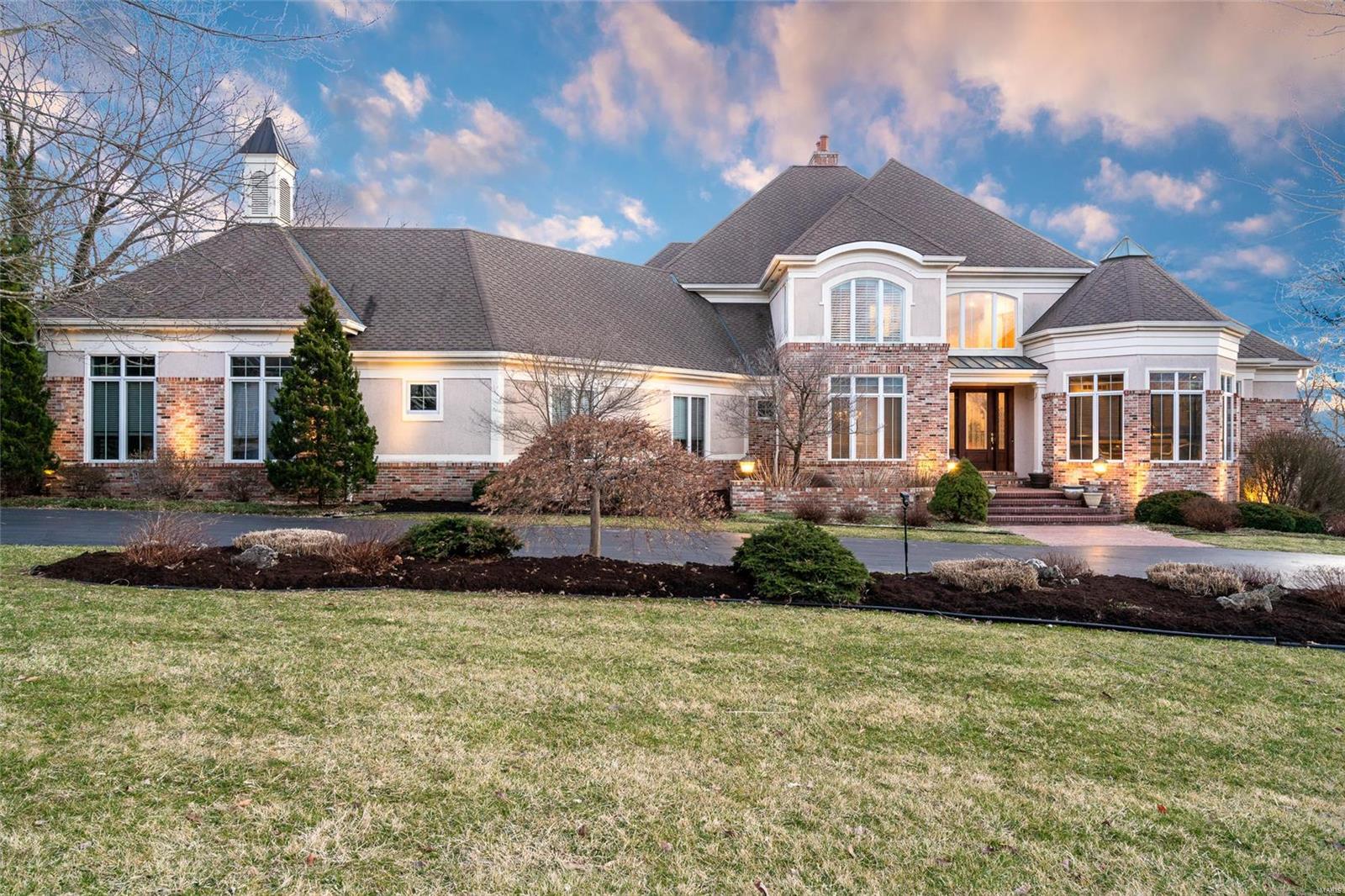 Exquisite 1.5story, 4Bed, 6Bath, 1.06acre property nestled in the sought-after neighborhood of The Estates at Mill Hill. Located in Award Winning Lindbergh School District this beautiful home exudes elegance & luxury throughout each detail. Enjoy the sun filled great rm showcasing 2story windows & accented w/ dbl sided FP. Gourmet chefs kitchen complete w/ 1yo SubZero fridge, 1yo Wolf dbl oven/range & large breakfast area accompanied by a cozy hearth rm creates an ideal setting for gatherings. Main flr master w/ his/her walk-in closet, gas FP & newly updated full bath boasting heated flrs. Additional 3 upper beds allow enough space for a growing family or out of town guest. Beautifully finished walkout LL equipped w/ a full bar, rec area, media rm & 2 wine cellars that hold 1,000+ bottles, truly an entertainers paradise. 4 car showroom garage has plenty of space for all the “toys”, newer Zoned Geothermal HVAC, private wooded backyard w/ pond & direct access to Sunset Country Club!!! Additional Rooms: Wine Cellar