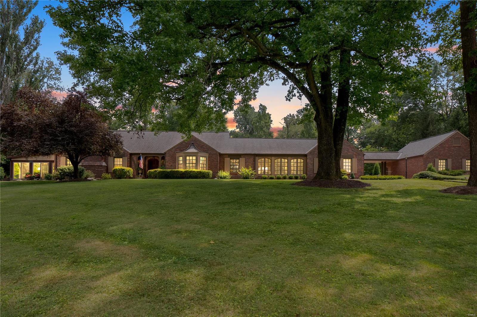 Beautifully updated & expanded estate w/over 4,700 sq ft of living space situated on 1.5-acre lot w/a peaceful park-like setting! Nestled in a quiet subdivision w/central Creve Coeur location & within Ladue School District! Walk into the beautiful foyer featuring original architecture extending to the formal LR & DR. Open & spacious kitchen fit for a chef, featuring 42" cabinetry & granite countertops, center island w/breakfast bar, SS appliances, gas stove & 2nd built-in oven! Highlight of the property is the 4-season sunrm w/stamped concrete flr, surrounded by Marvin Doors outfitted w/reclaimed Douglass Fir & Red Cedar wood. Main flr is complete w/2 BD, including the luxury master suite, & 2nd full BA. Upstairs boasts 2 additional BD & 1 full BA. Finished LL features custom mahogany bar, large family rm, xtra large laundry rm w/storage, & a 1/2 BA. Large bkyd w/plenty of room for recreation featuring greenhouse & a guesthouse w/full quarters! Heated 4-car garage w/additional parking. Additional Rooms: Sun Room