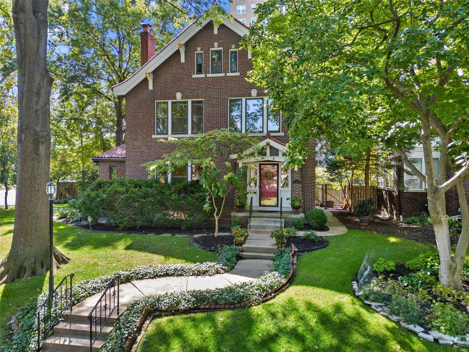 Welcome to 2 Arundel! Overlooking Forest Park, this home has so much to offer! Step into the entry hall & you will see hardwood floors, leaded glass windows, french doors, crown molding, deep baseboards, a fireplace, built-in bookcases, a huge dining room, & much more. The custom kitchen with center island opens to the dining room & the charming sunroom overlooking the patio, beautiful gardens & pond. The second floor has 4 bedrooms. The primary bedroom is complete with full bath, & a walk-in cedar custom closet. There is a light-filled sunroom off the primary bedroom, perfect as a reading room, office, or an exercise room. The 3rd floor has 2 spacious bedrooms & a full bath with original clawfoot tub.  A 2 car garage too! Don't miss your chance to live so close to the museums, zoo, & golf courses. Walk to the shops & restaurants on DeMun. Just minutes to Wash U, SLU, Barnes, & more. The fully fenced yard is truly a gardener's delight & there always seems to be something blooming! Additional Rooms: Sun Room