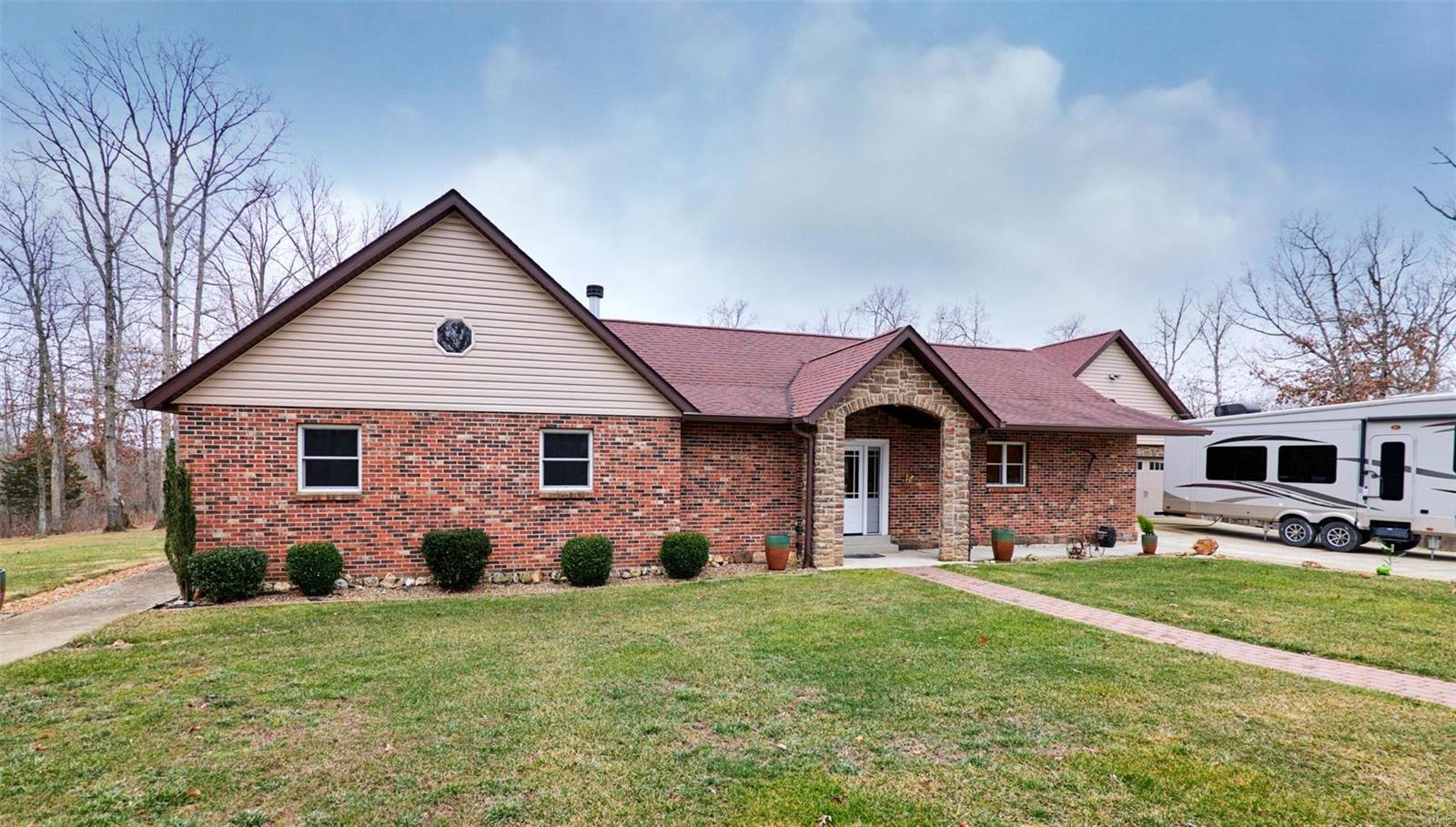 Incredible opportunity to own 89+/- acres within 10 minutes of Warrenton and I-70.  Recreate where you live!  Beautiful custom 3 bedroom ranch home that shows the pride of home ownership!  The open concept features a spacious kitchen with large center island, quartz countertops, custom knotty alder cabinetry and doors and SS appliances.  Great room features a full masonry wood burning fireplace with blower for additional heat & savings on your electric bills.  Mostly finished basement offers a recreation room, full bath with heated floors, wet bar, exercise & office space.  Outside there is a 28 x 22 stamped patio off the breakfast room, and a covered deck with composite flooring off the dining room giving you plenty of space to entertain and enjoy nature in your own private retreat.  For the outdoor enthusiast, there are 89+/- acres full of trails, deer, food plots, year round live creek and a stocked pond for fishing.  Additional 30x30 outbuilding to store all your toys!
