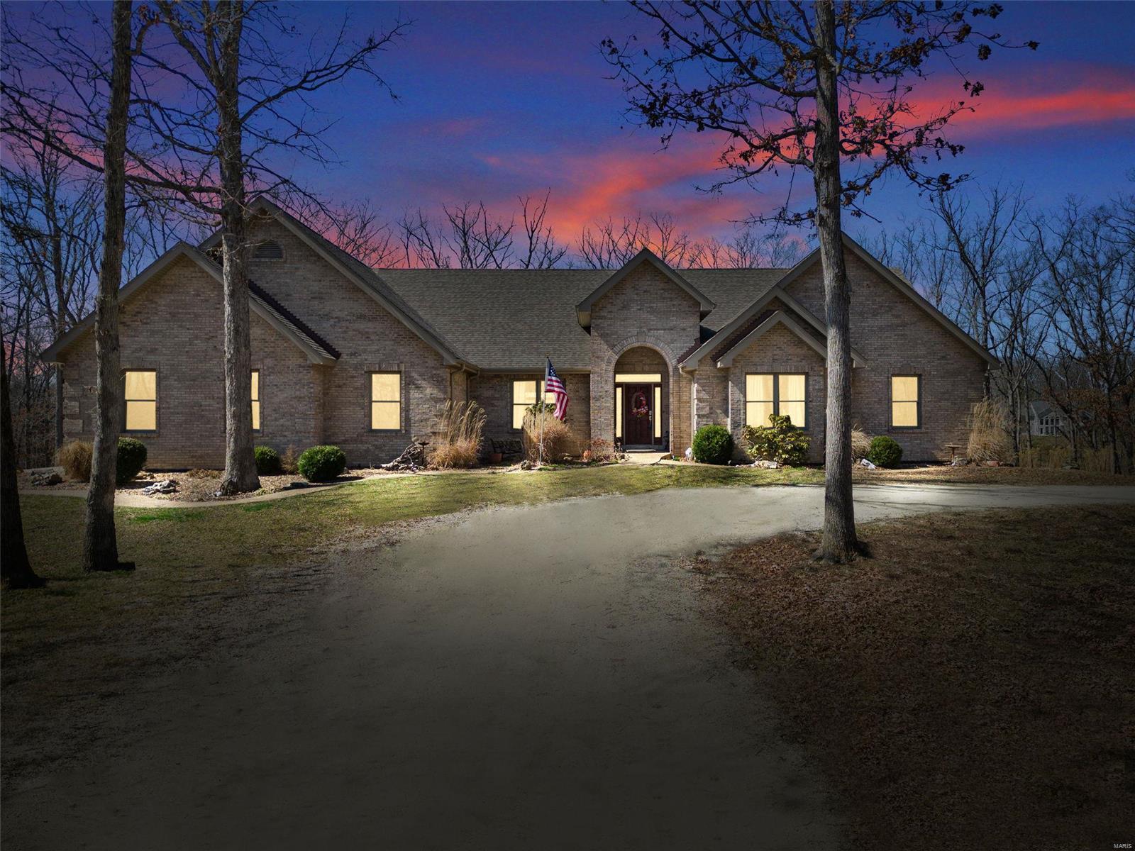 Looking for a private luxury estate? This custom built all brick ranch situated on 32 private acres with a 7 car garage. This home is quality built with approx. 3,100 sq. ft. on the main level w/ the same footprint below ready to be finished. The walk out LL has windows all t/o and a beautiful fireplace.  The sprawling kitchen offers stainless steel appliances, walk-in pantry, custom cabinetry built by the Amish, a planning desk and a butlers pantry. The breakfast/hearth rooms are open to the kitchen and lead you to a sprawling composite deck perfect for entertaining. Large formal dining room w/ hardwood floors and sunken great room w/ beautiful floor to ceiling stone fireplace.  Oversize heated/cooled 3-car garage w/ bonus room built above & detached 40x45 garage w/ soaring ceilings perfect for an RV/workshop and/or storage, could easily hold 4 or more cars. The 32 acres is mostly wooded, w/ trails t/o  perfect for recreational riding & hunting. Less than 10 minutes from Hwy. 70!