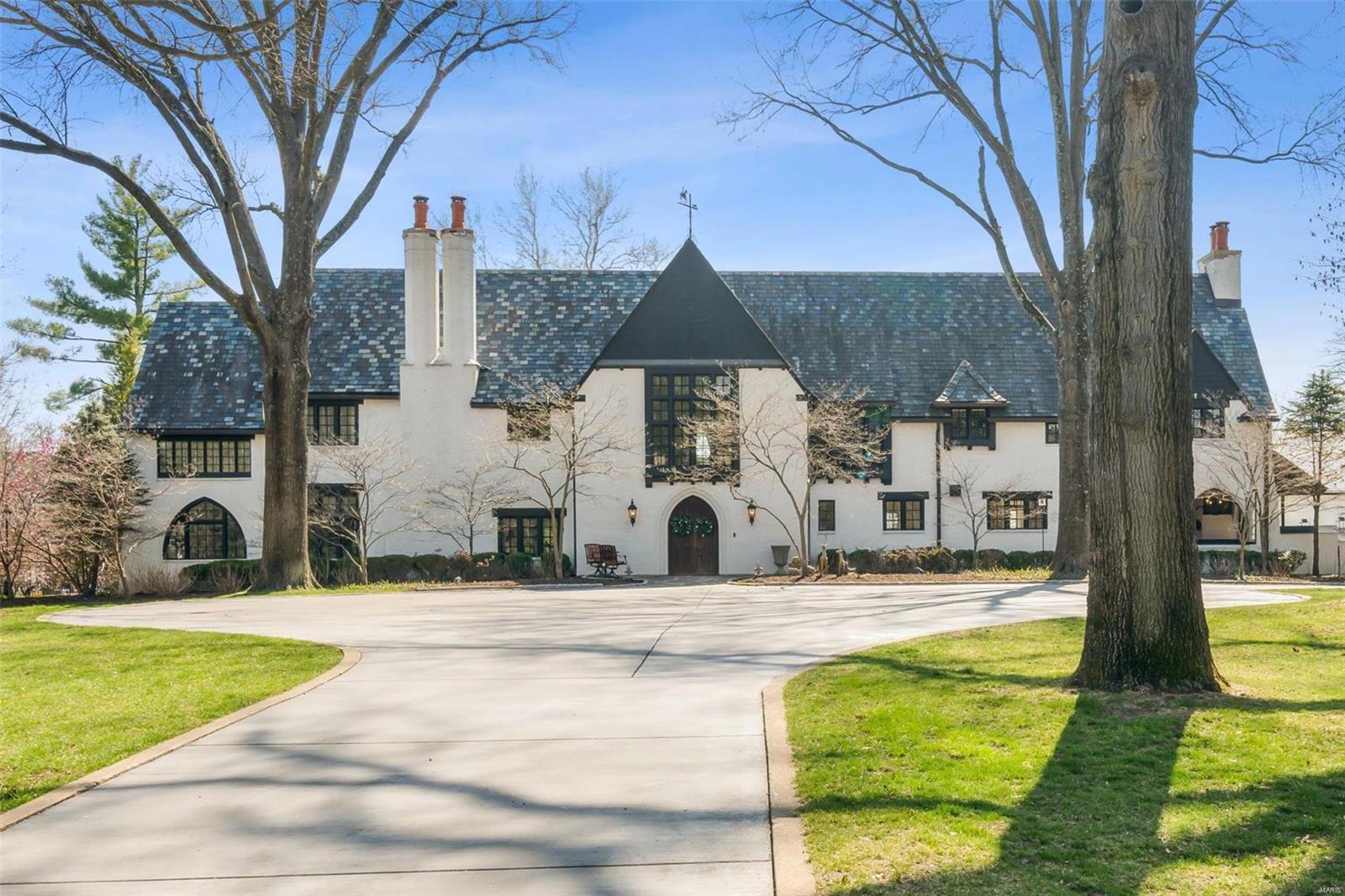 Discover opulent living in this Maritz and Young-designed masterpiece. This exceptional 9000+ square foot estate boasts 5 bedrooms, 6.5 baths and a fully renovated guest house with 2 bedrooms and 2 full baths. Meticulously curated, this property exudes exclusivity with a gated entry, heated cobblestone driveway, gas lanterns and a lush 1.8-acre landscape featuring several outdoor living areas. Enter through the grand foyer with terrazzo flooring, revealing tastefully appointed living spaces. A spacious bonus room, adorned with slate flooring and reclaimed wood beamed ceiling, featuring a bar area and spiral staircase leading to a home gym/hobby room—a luxurious haven for entertaining. The gourmet kitchen, a culinary epicenter, integrates high end appliances, Italian marble backsplash and many custom finishes including a wood- burning pizza oven. This residence epitomizes architectural brilliance and luxury living, offering an unparalleled lifestyle of elegance, comfort and convenience.