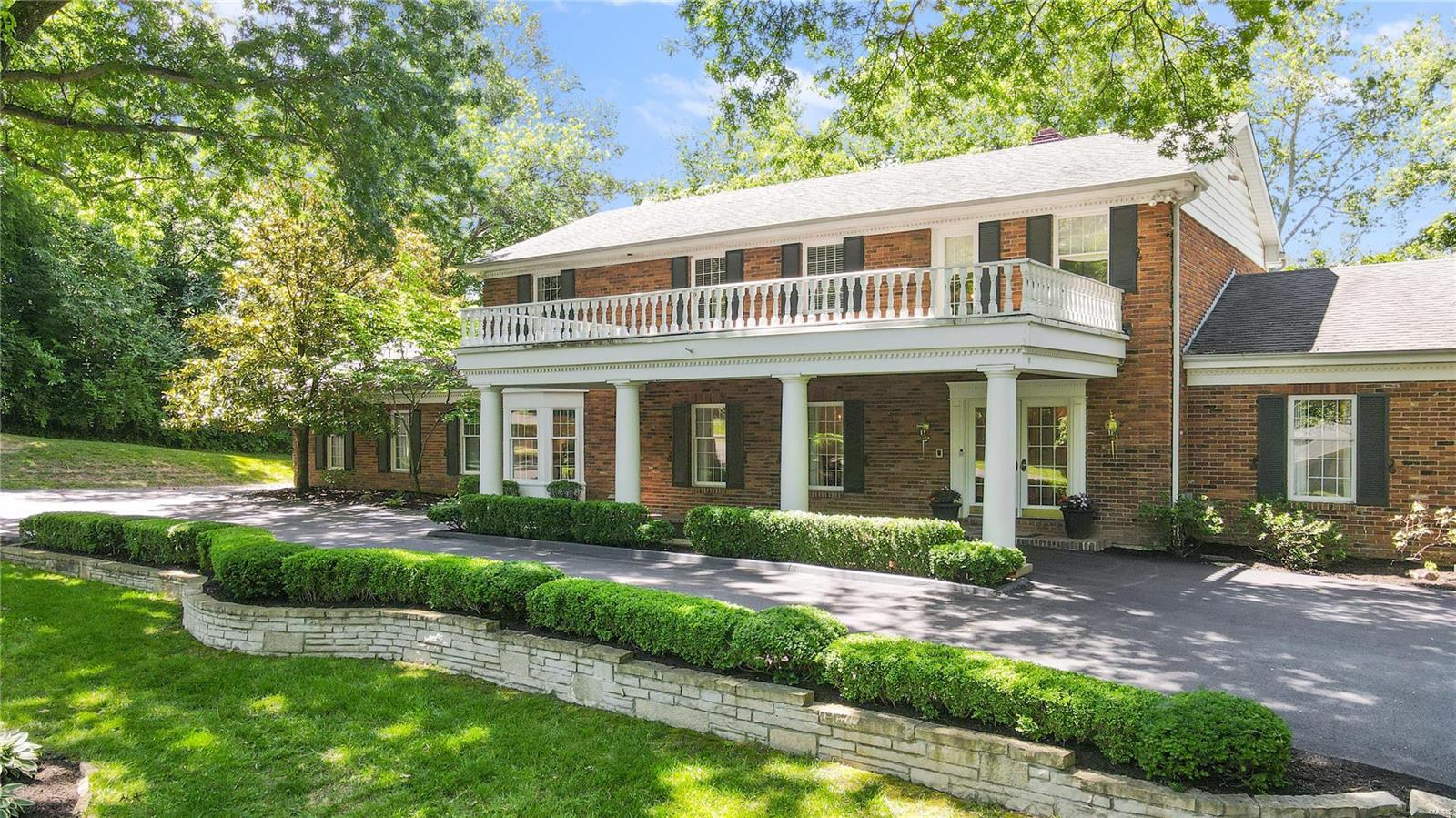 Lovely two-story brick home perched on 2 extremely private acres in the prestigious city of Huntleigh.This classic 5 bed, 5 bath home offers over 5,000sqft of living space perfect for raising a family & entertaining.  Impressive curb appeal begins with the porte-cochere and beautiful landscape.  Gorgeous wooded yard w mature trees features an in-ground pool, fire pit & plenty of space to BBQ on the patio. Highlights include en suite primary bedroom w 2 separate vanities & large shower.  Main floor features extremely spacious living and dining room, family room w hand-hewn exposed beams & fireplace, and walk-behind bar.  Additionally, enjoy the convenience of laundry/mudroom off garage entrance & beautiful sunroom open to the patio & overlooking the rear landscape. Expansive, finished lower level w recreation room, sleeping area, exercise room, full bath and walk-out to the pool. Exceptional opportunity to live in Huntleigh with access to Kirkwood schools. Additional Rooms: Mud Room, Sun Room
