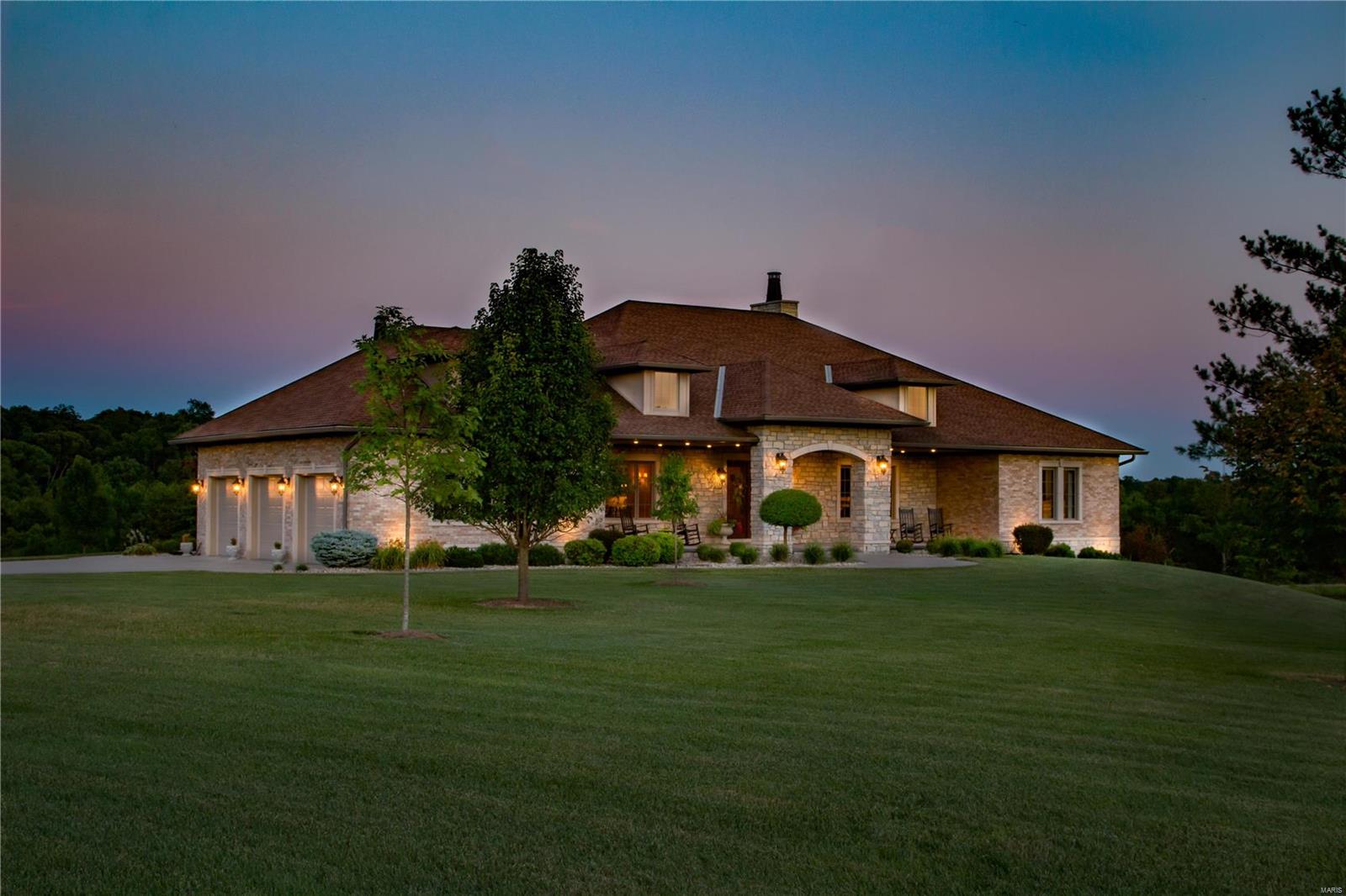 Luxury country living at its finest includes approx. 32.8 acres, outbuilding and stocked lake with 6,250 sq.ft. stone and brick ranch style home designed with sophisticated details in mind. Lavish upgrades are evident throughout including a gourmet kitchen, breakfast area with stone fireplace, walk in pantry, large great room with stone fireplace, formal study, dining room and an impressive master suite with incredible views. The large covered back patio features a built-in cooking area in addition to the stone fireplace and overlooks the 2 acre stocked lake. The lower level offers a large home theater with surround sound, formal bar, wine cellar, 2nd family room, add'l bedroom and game room. The insulated outbuilding is 42 x 64 with a 12’ overhang and features a finished living space. Conveniently located just minutes from the interstate and 30 minutes from St. Louis, MO. Additional Rooms: Wine Cellar